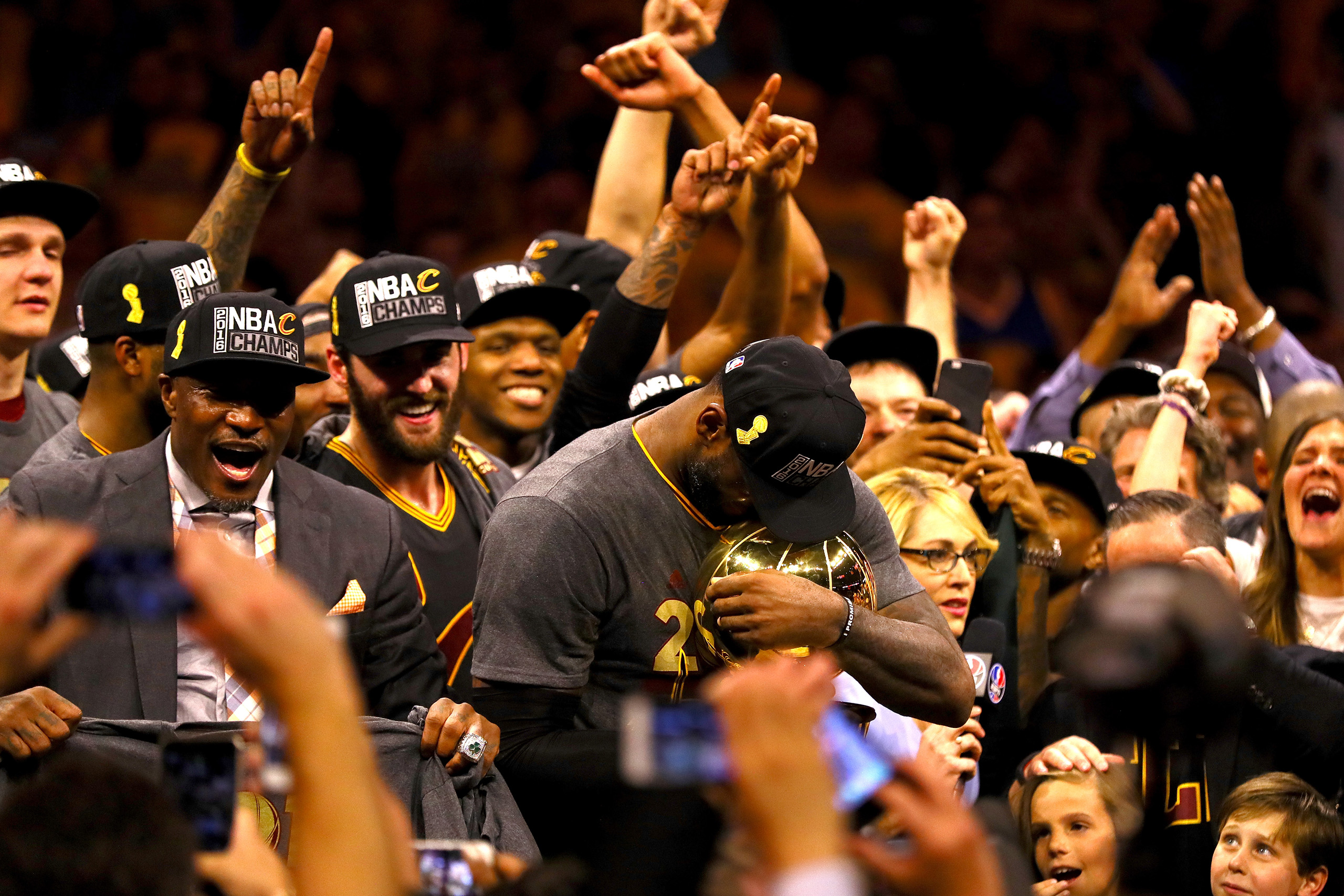 LeBron James, #23 of the Cleveland Cavaliers, holds the Larry O'Brien Championship Trophy after defeating the Golden State Warriors 93-89 in Game 7 of the 2016 NBA Finals at ORACLE Arena in Oakland, Calif., on June 19, 2016.