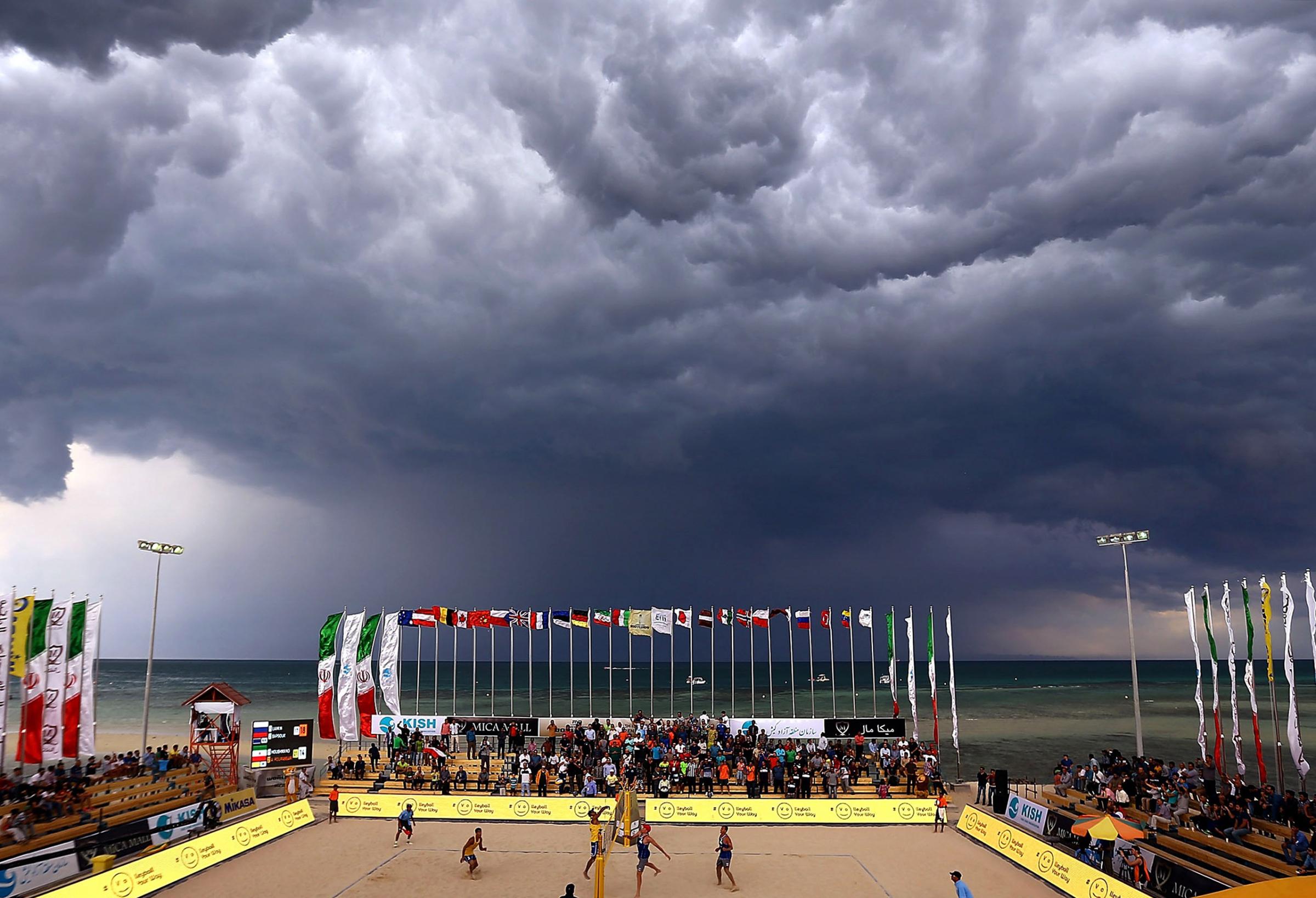 A general view of court action as the weather closes in on day 3 of the FIVB Kish Island in Iran on Feb. 17, 2016.