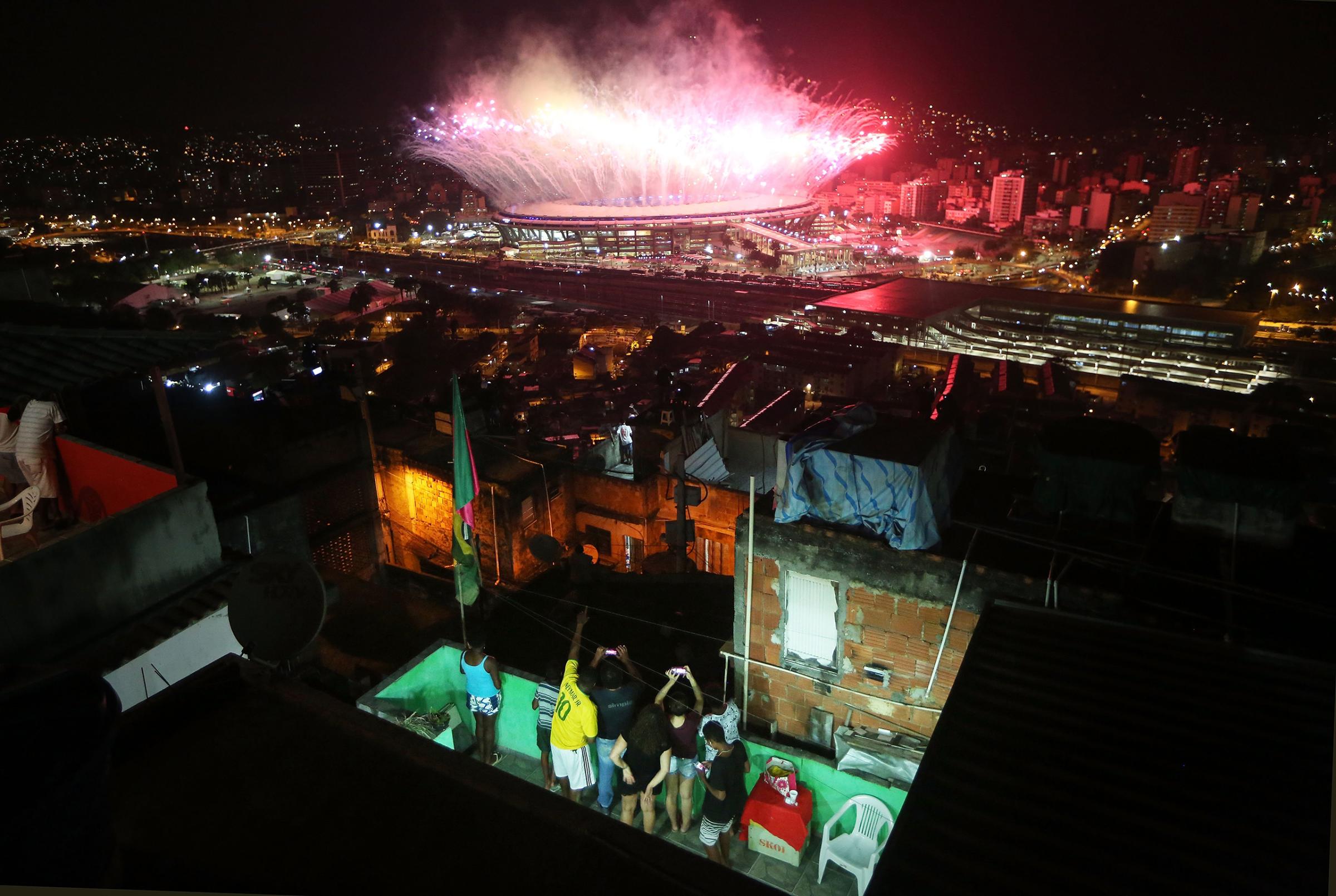Fireworks explode over Maracana stadium with the Mangueira 'favela' community in the foreground during opening ceremonies for the Rio 2016 Olympic Games on Aug. 5, 2016.