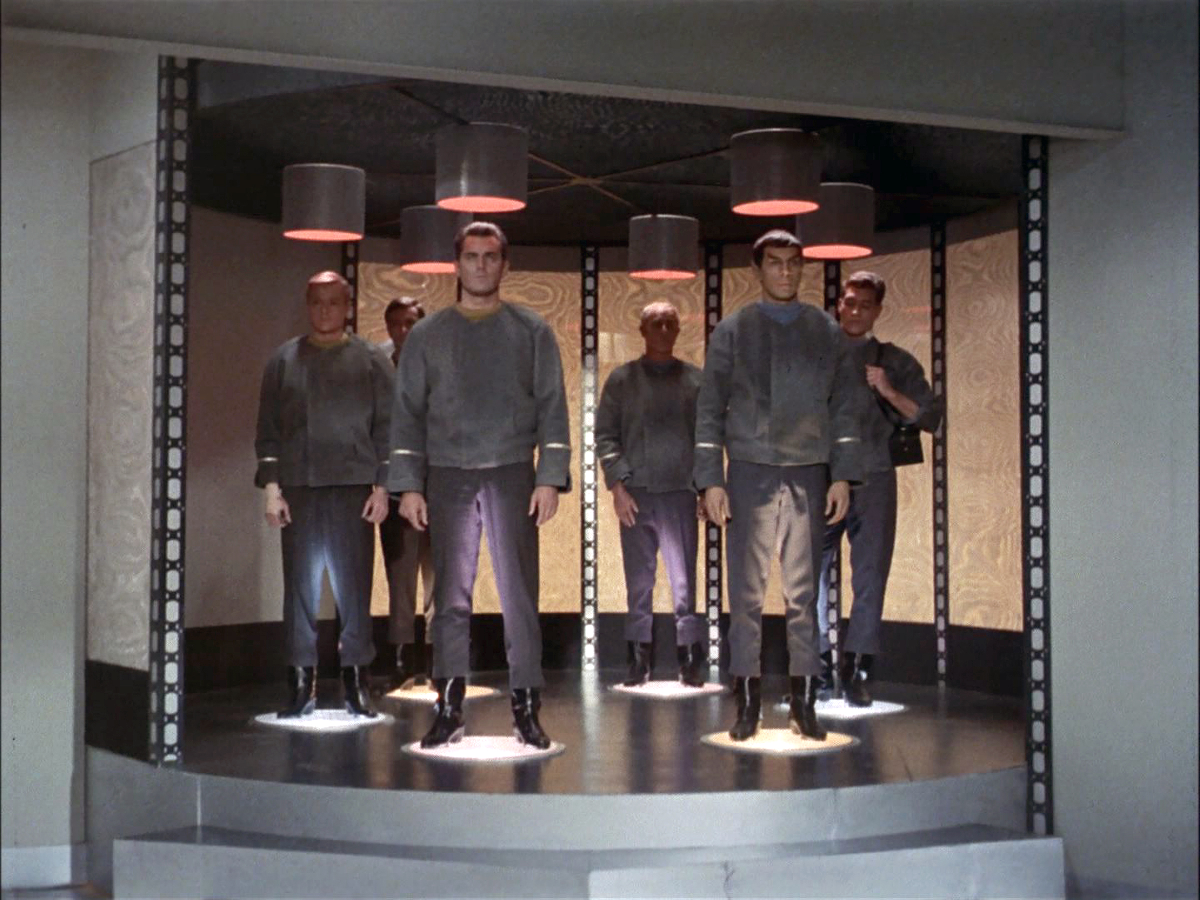 The crew of the USS Enterprise being transported. From left: Peter Duryea as Lieutenant José Tyler, Adam Roarke as Communications Officer Garison, Jeffrey Hunter as Captain Christopher Pike, John Hoyt as Dr. Phillip Boyce, Leonard Nimoy as Mr. Spock and Ed Madden as the Enterprise Geologist.