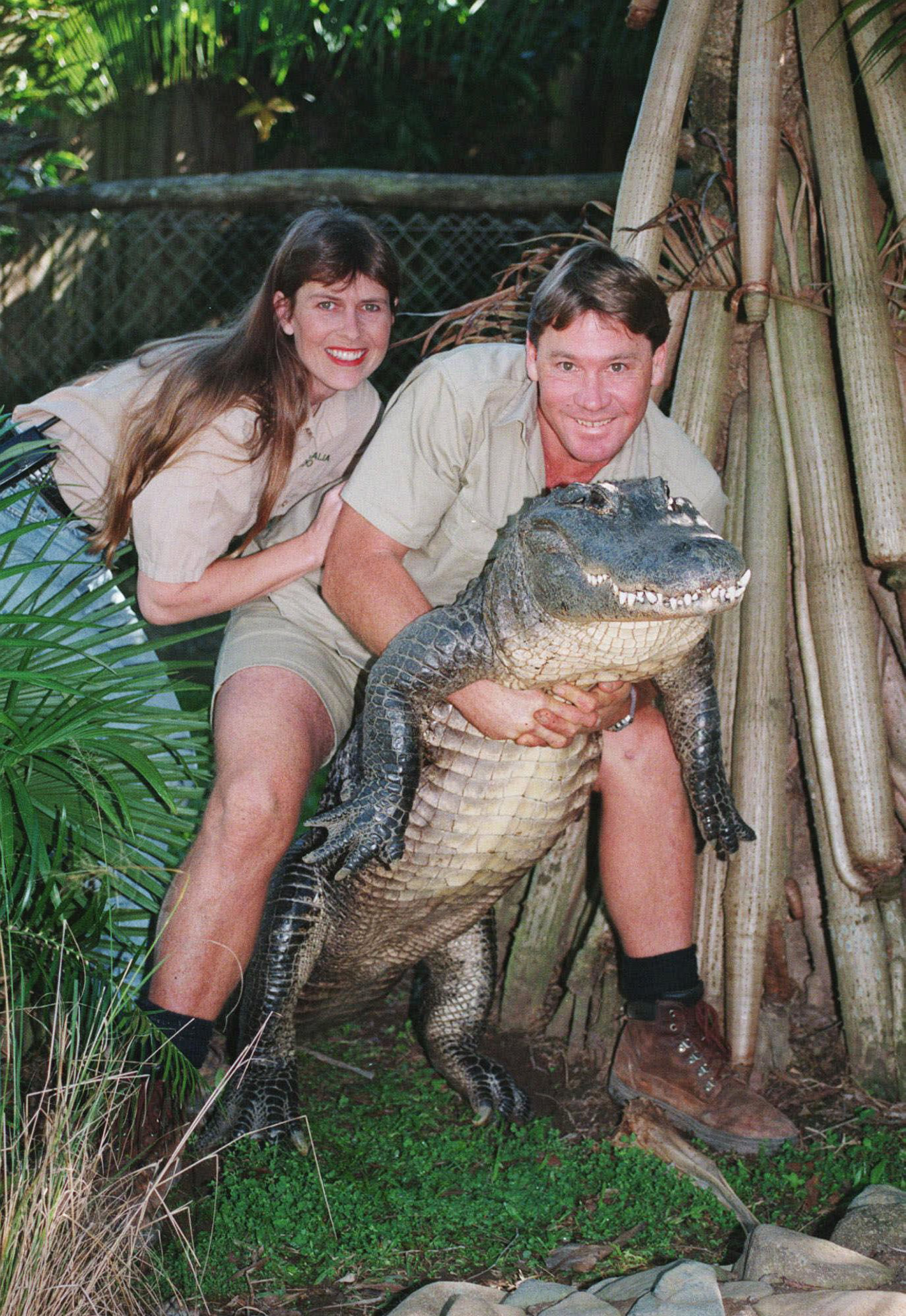 Steve Irwin, holding a nine-foot female alligator, and his wife Terri at their "Australia Zoo" in Beerwah, Australia, on June 18, 1999. (Russell McPhedran—AP)