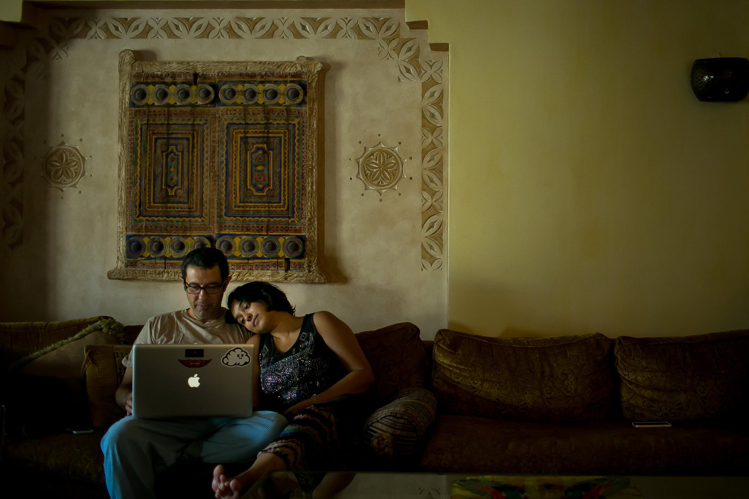 Raneen, an art curator and gallery owner, sits with her father while Facetiming her husband on the computer at her parents' home in Khobar, October 2015. "My father sat beside me filming as I drove, joining fellow women drivers pushing back in well documented 2013 protests," she told the photographer. "It is with my parents support that I was able to find love, to follow my dream of opening a gallery and be the woman I am."