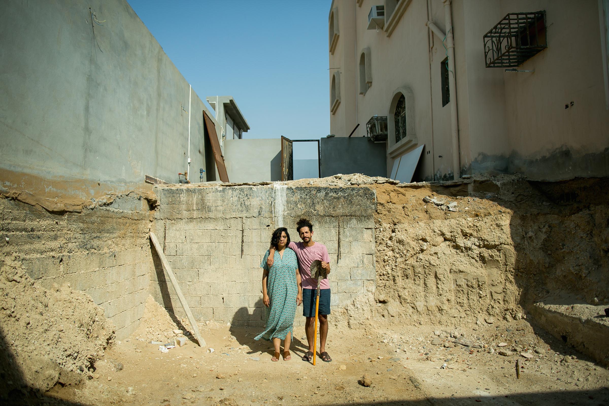 Raneen, an art curator and gallery owner, and Hisham, a comedian and actor, opted for a Saudi-style "American Gothic" portrait in their unfinished swimming pool in Jeddah, December 2015. "I first met her on Twitter, then later in person," Hisham said. "Wanting nothing but fun, she told me off... I met her again at an ice cream shop. She charmed me with her happy ice cream dance." Raneen and Hisham were both previously married and divorced. Now married to each other, they realize their past mistakes. "We didn't believe in love, and were too cynical. We also thought of marriage as a duty. After we stopped searching for the one, that's when we met each other," he said.