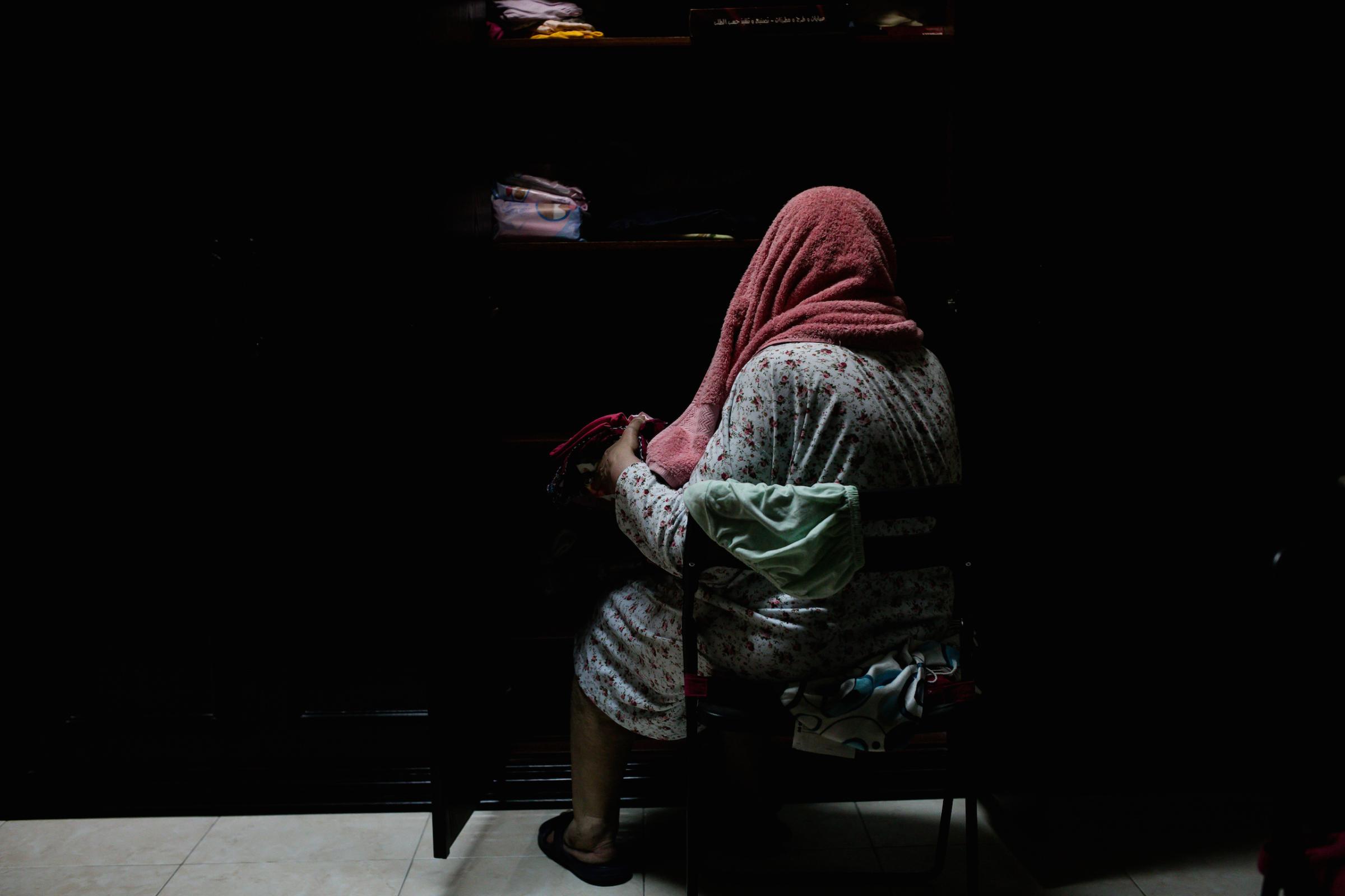 The photographer's grandmother in her home in Dammam, February 2016. "I've been married for 64 years. Have raised six men, and three daughters. I have more than thirty grandchildren," she told Alsultan. "Yet, I can't legally sign, or travel without a male guardian. Outside of this house, my youngest grandson has more authority than me." Alsultan recalls when explaining the divorce to her daughters being asked: "'but if your grandparents love each other, then why don't they share the same bed?!' It was funny how she noted a shared bed was a must." The photographer replied that her grandparents used to share a bed, but a few years earlier and having been married for about six decades, one opted to sleep under the air conditioner and the other wanted to stay away: "It's not always about appearances."