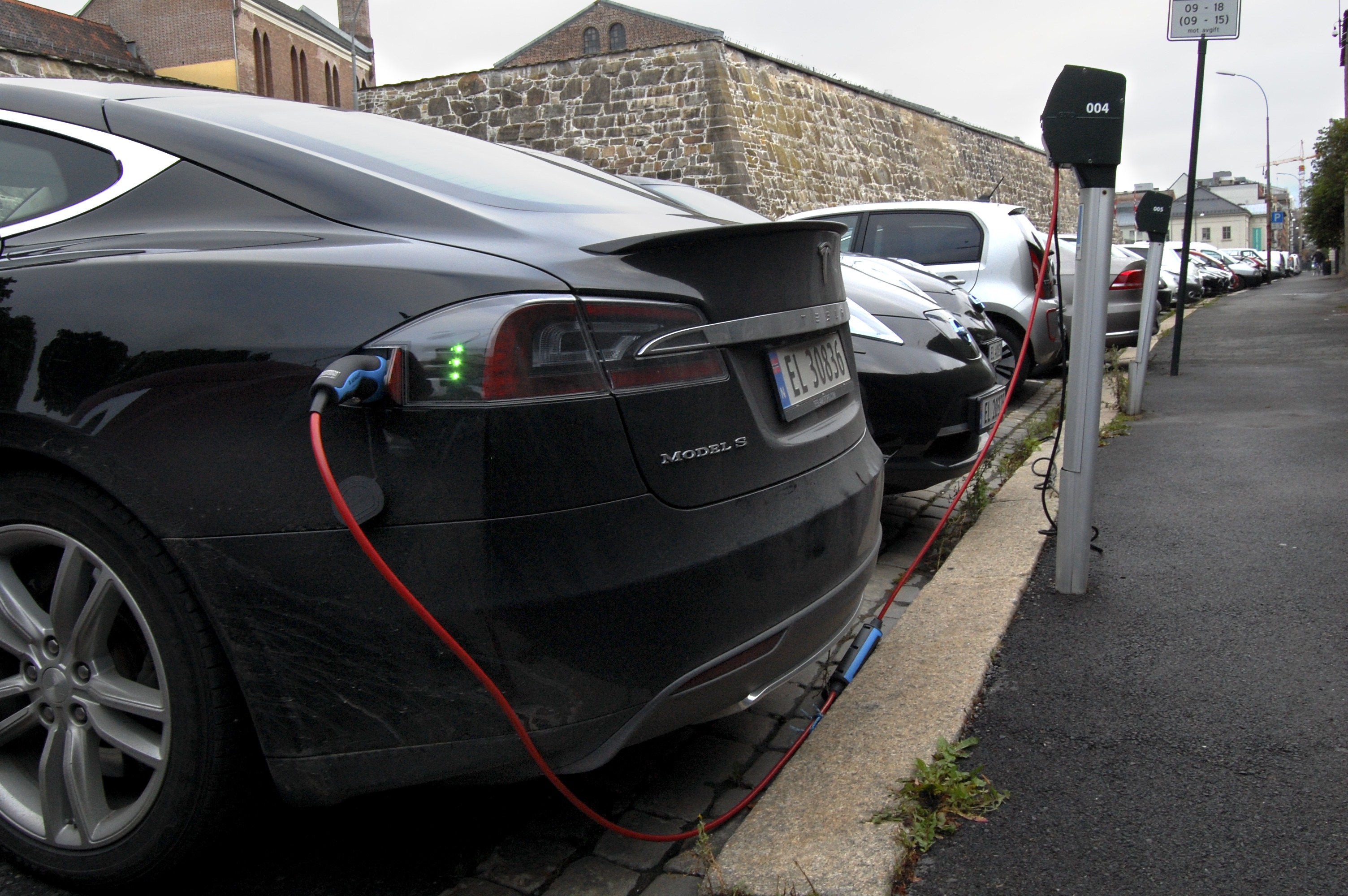Cars are seen charging in free parking spaces for electric cars in central Oslo on Aug. 19, 2014. (Pierre-Henry Deshayes —AFP/Getty Images)