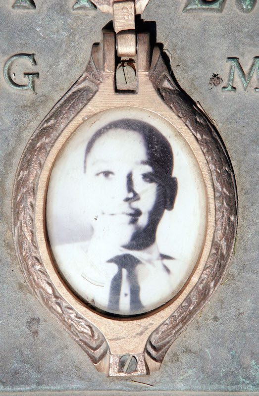 A photo of Emmett Till is included on the plaque that marks his gravesite at Burr Oak Cemetery in Aslip, Ill. Seen here in 2005. (Scott Olson—Getty Images)