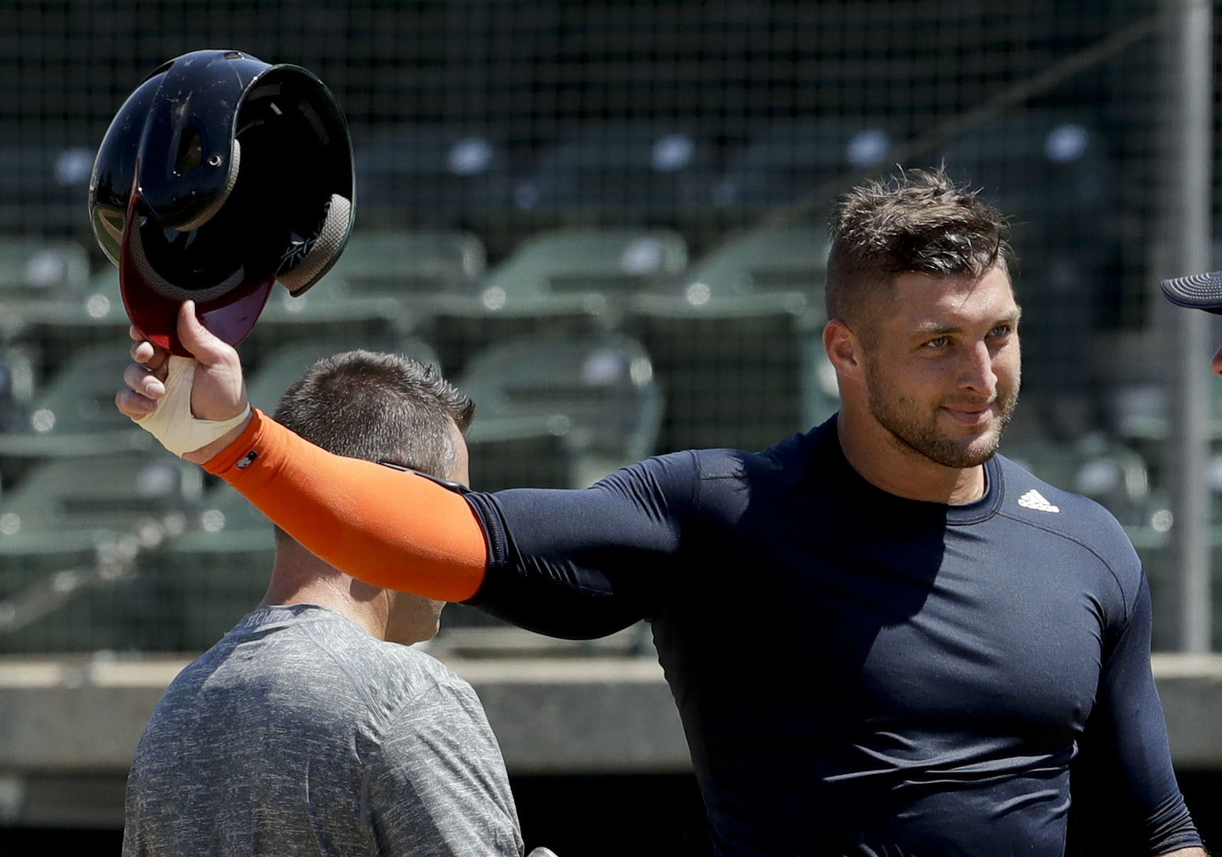 Former NFL quarterback Tim Tebow finishes his work out for baseball scouts and the media in Los Angeles on August 30, 2016. (Chris Carlson—AP)