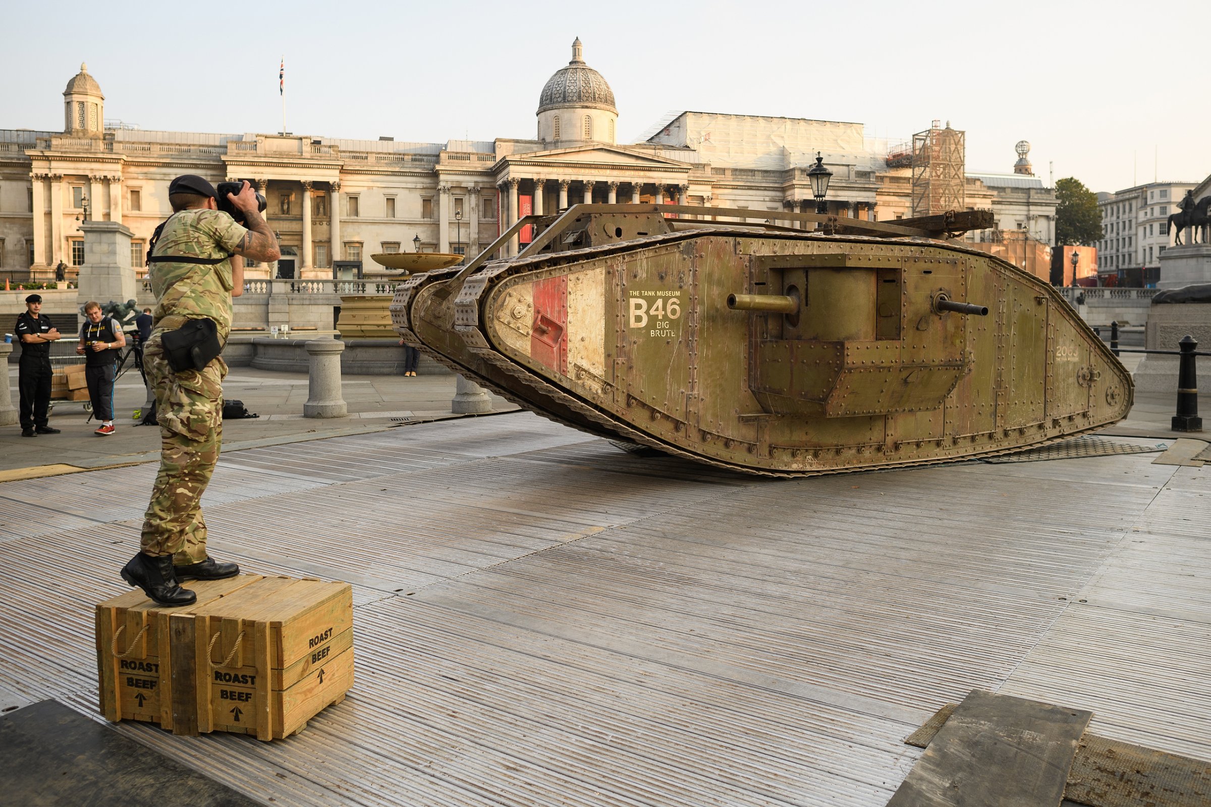 LONDON, ENGLAND - SEPTEMBER 15: An Army photographer takes a photograph of a replica British Mark IV tank as it is displayed in Trafalgar Square on September 15, 2016 in London, England. The tank is in place to mark 100 years to the day since they were first used in action during World War One. (Photo by Leon Neal/Getty Images)