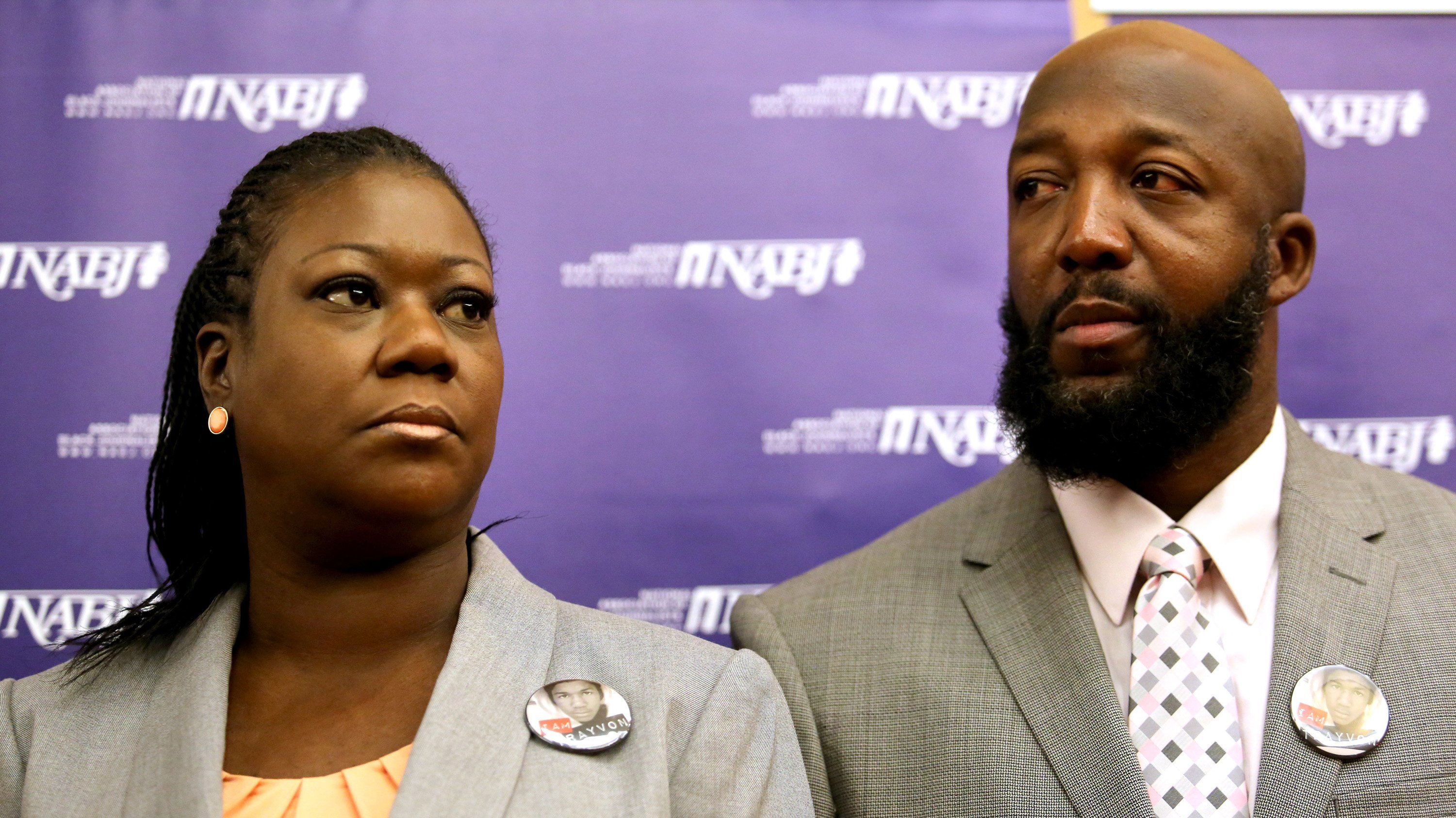 The parents of Trayvon Martin, Sybrina Fulton, left, and Tracy Martin, listen to their attorneys, during a news conference at the National Association of Black Journalists national convention, in Orlando, Florida, Friday, August 2, 2013. (Joe Burbank/Orlando Sentinel&mdash;MCT/Getty Images)
