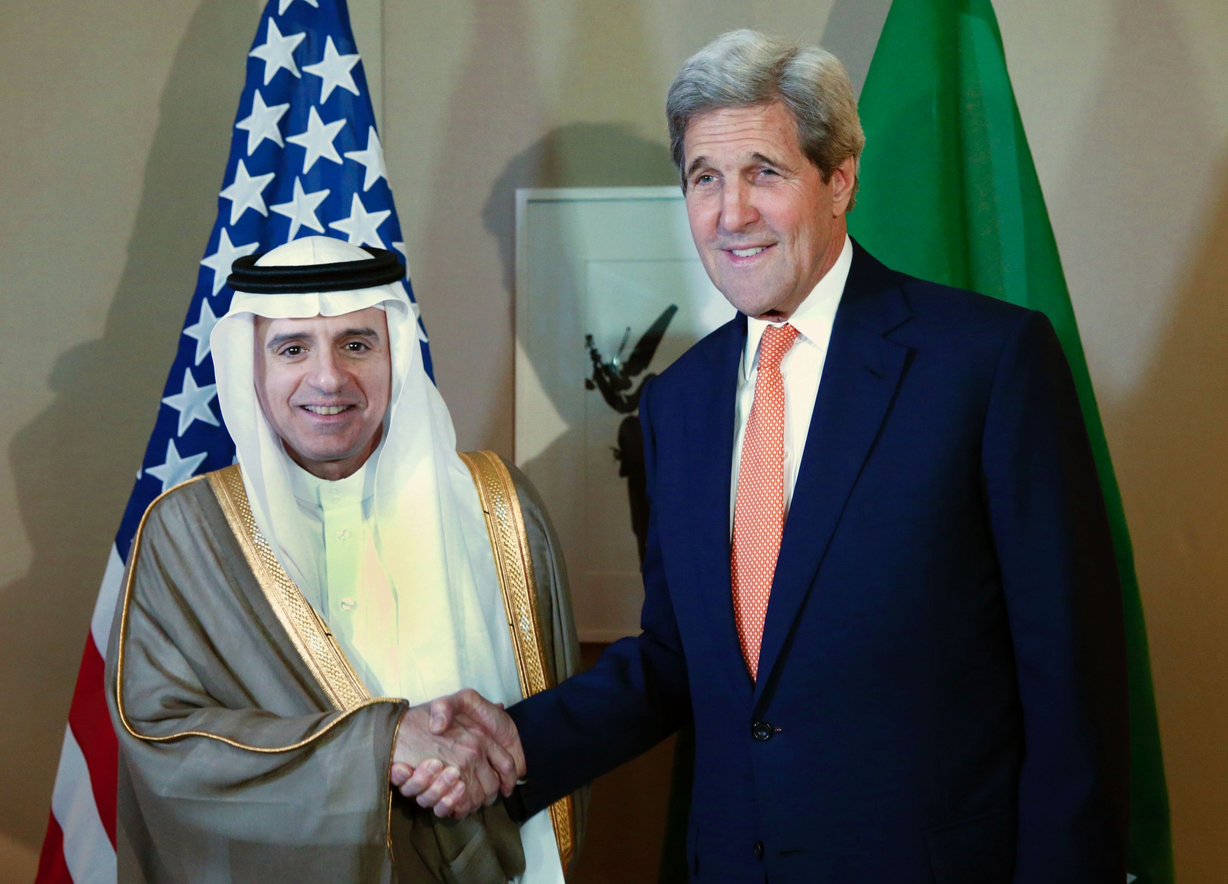 Saudi Foreign Minister Adel al-Jubeir shakes hand with US Secretary of State John Kerry during a meeting on Syria in Geneva, on May 2, 2016.