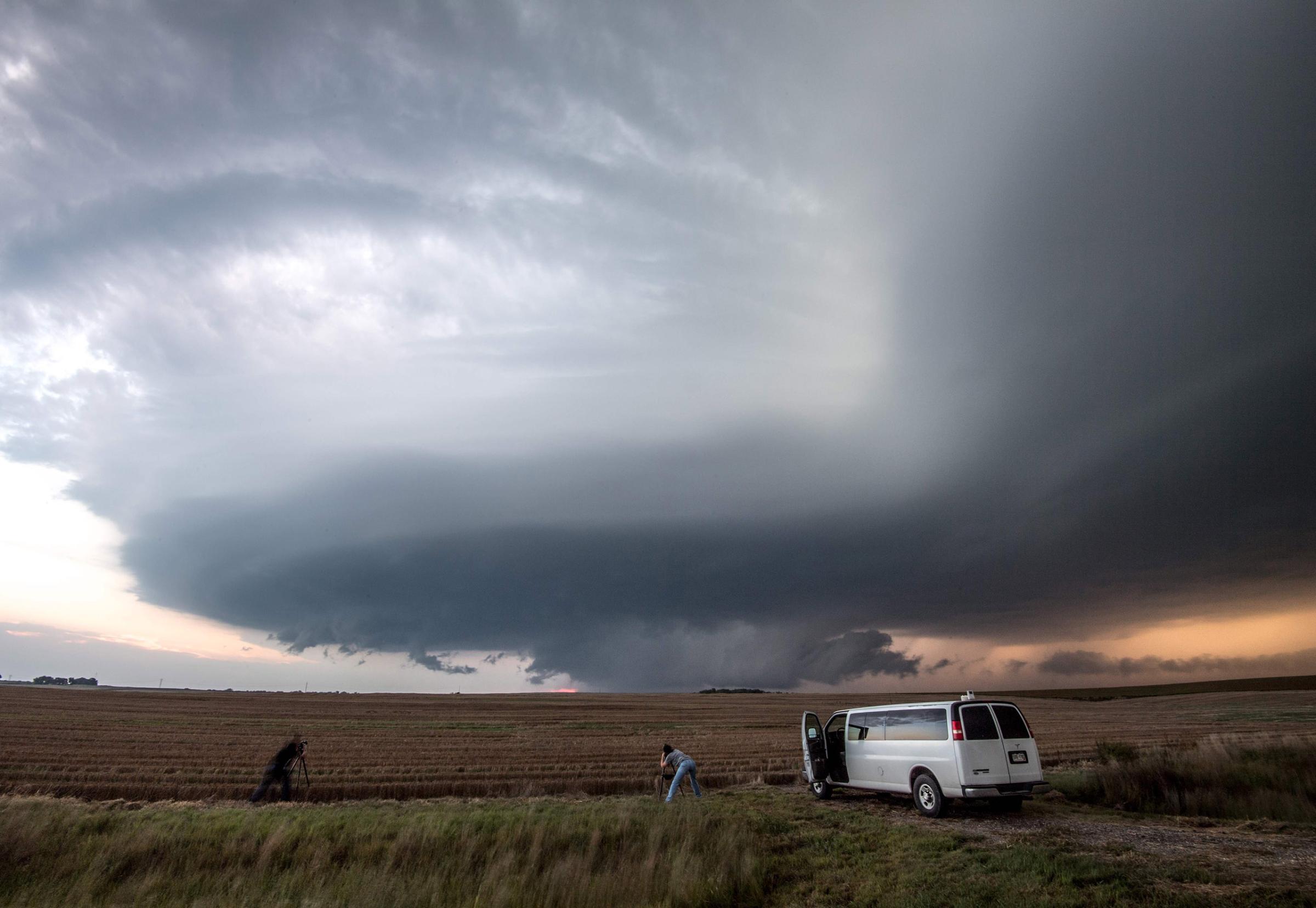 Storm chasing photographers underneath a rotating supercell storm system in Maxwell, Nebraska on Sept. 3, 2016.