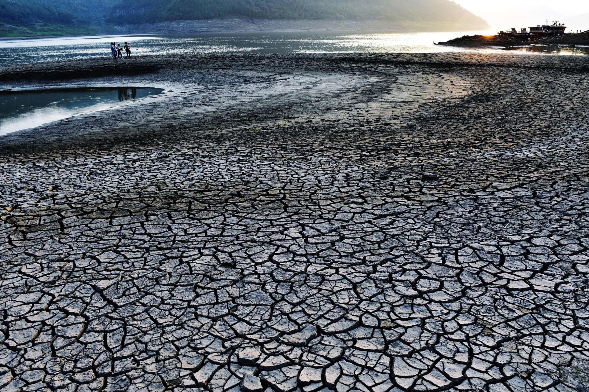The dried and cracked river beach of the Yangtze River in Yunyang county in Chongqing, China. The Chongqing weather station issued a red alert for high temperatures for 12 consecutive days from Aug. 14 to Aug. 24, 2016.