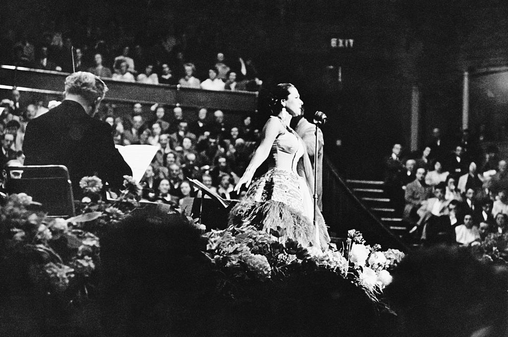 Peruvian soprano Yma Sumac (1922 - 2008) performs at the Royal Albert Hall in London, 1952. (George Douglas—Getty Images)