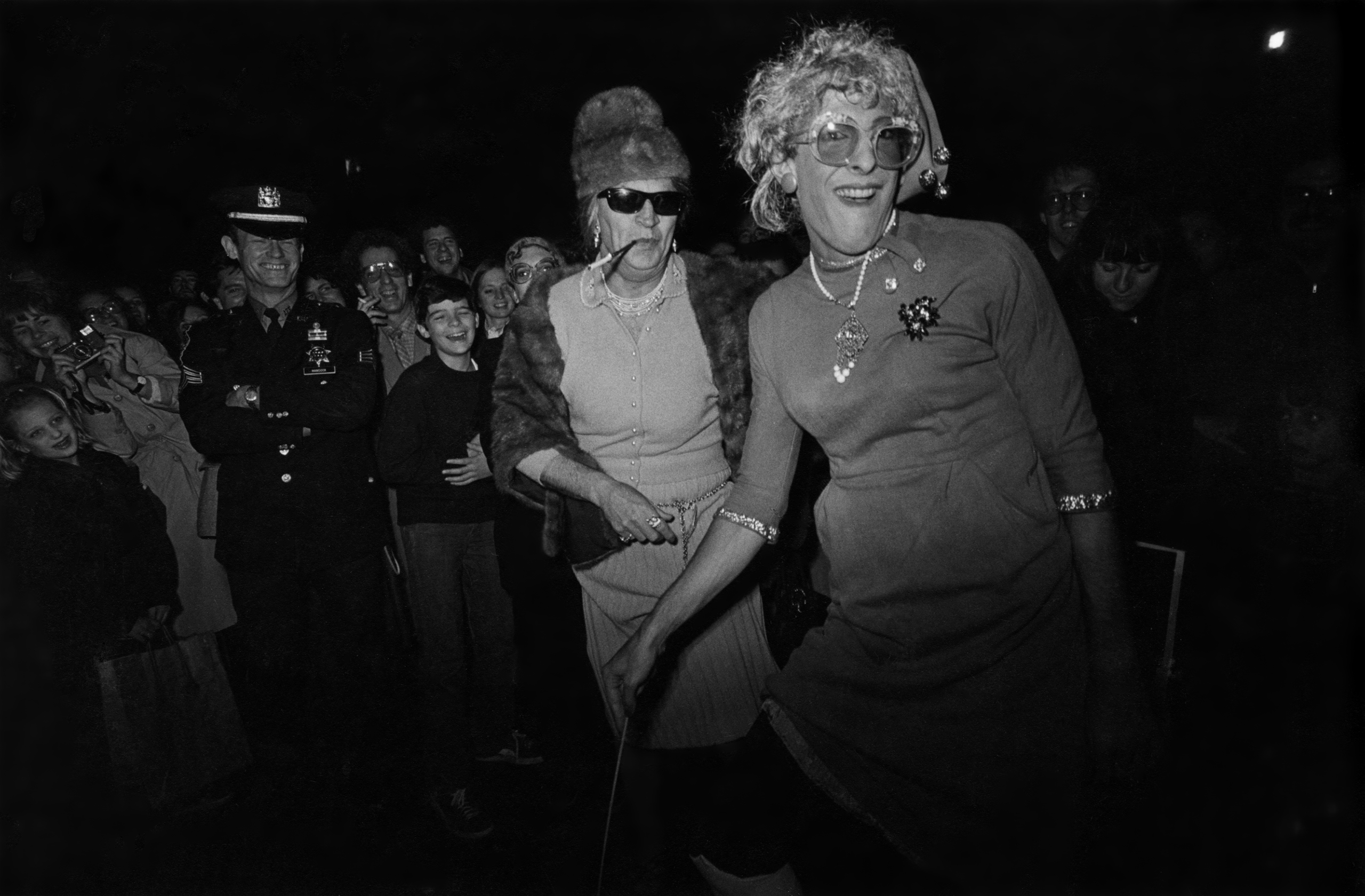 Two men in drag marching in the New York City Halloween Parade, 1980.