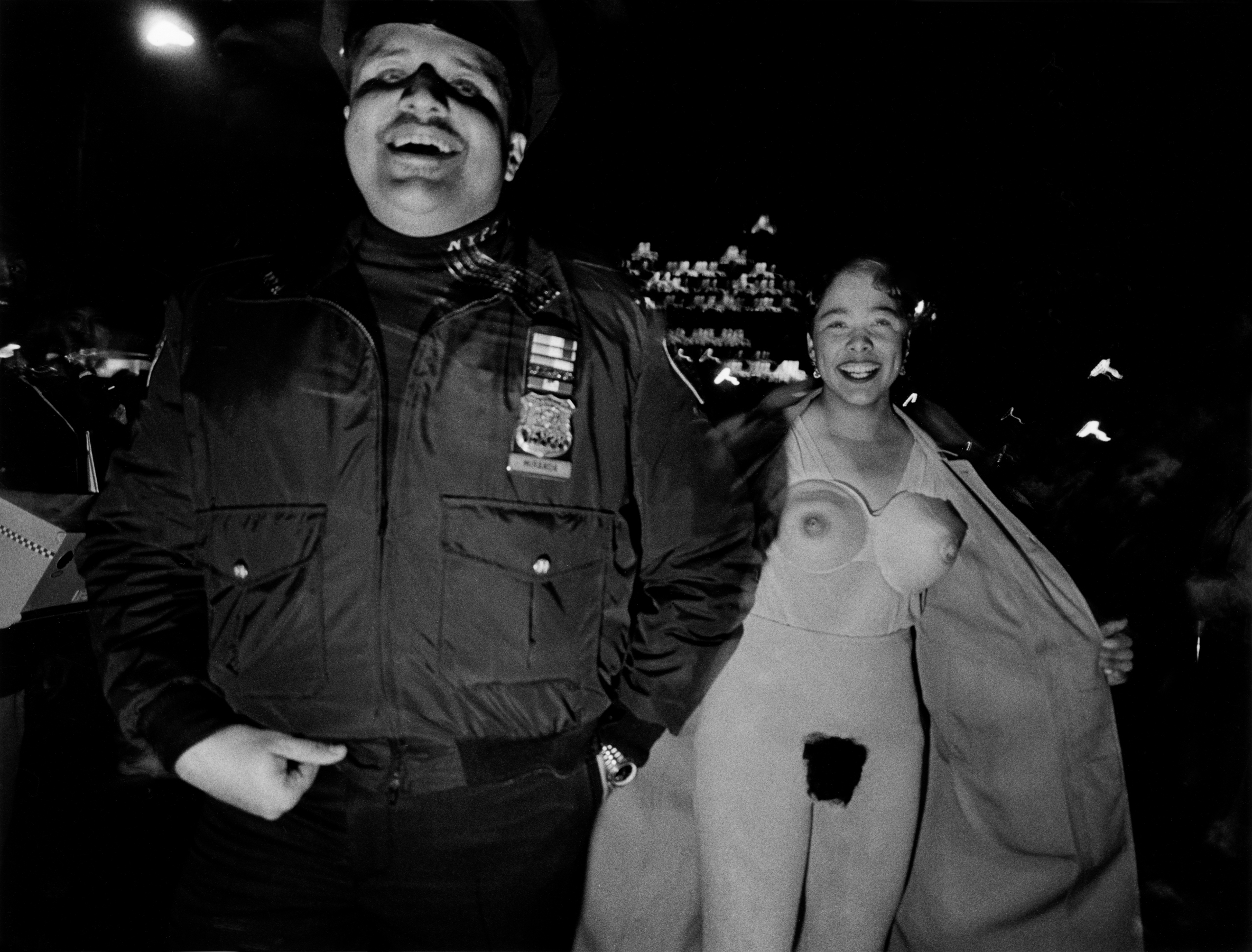 A woman flashes the camera at the New York City Halloween Parade, 1994.