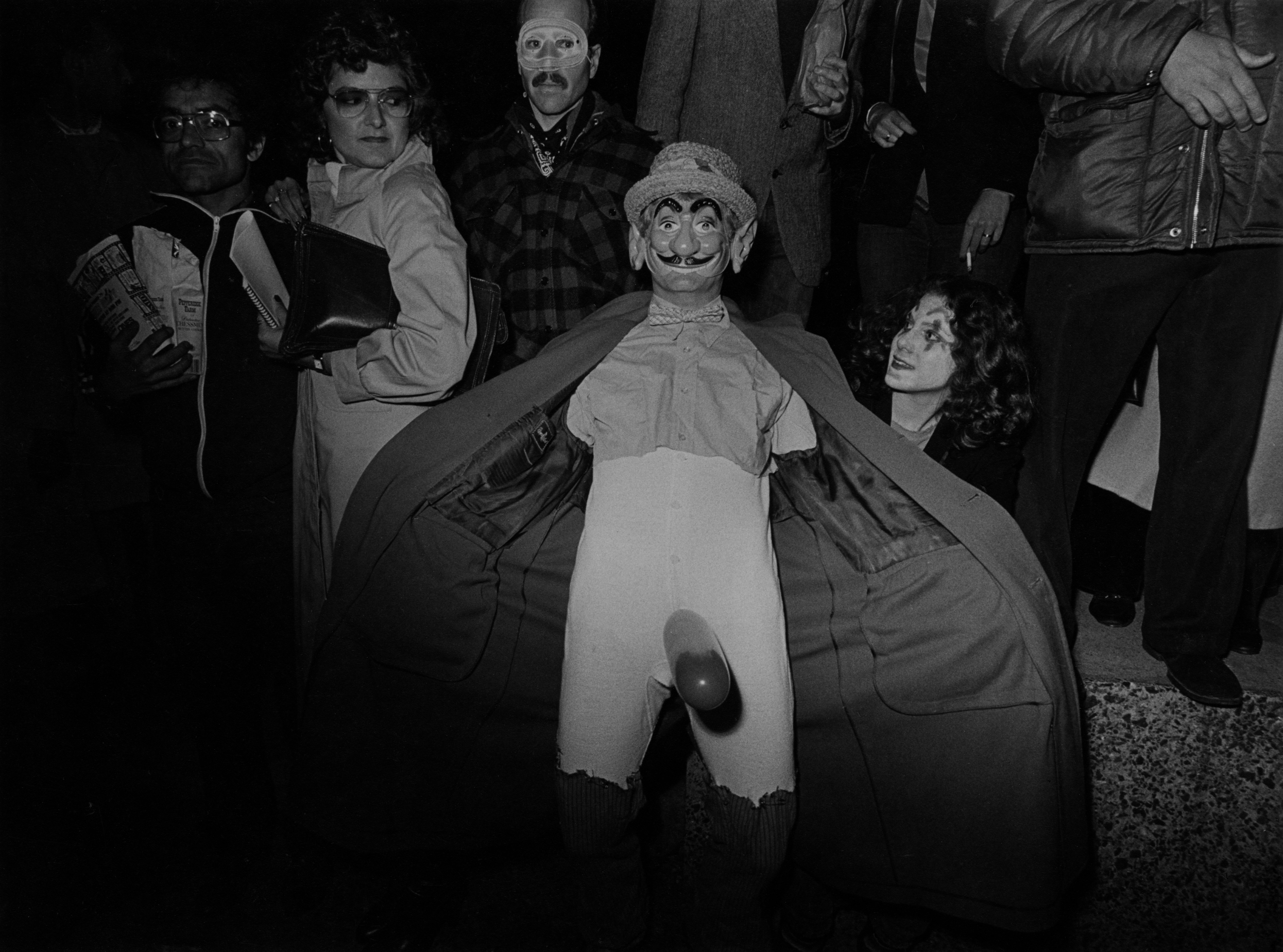 A flasher revels in the crowd at the New York City Halloween Parade, 1979.