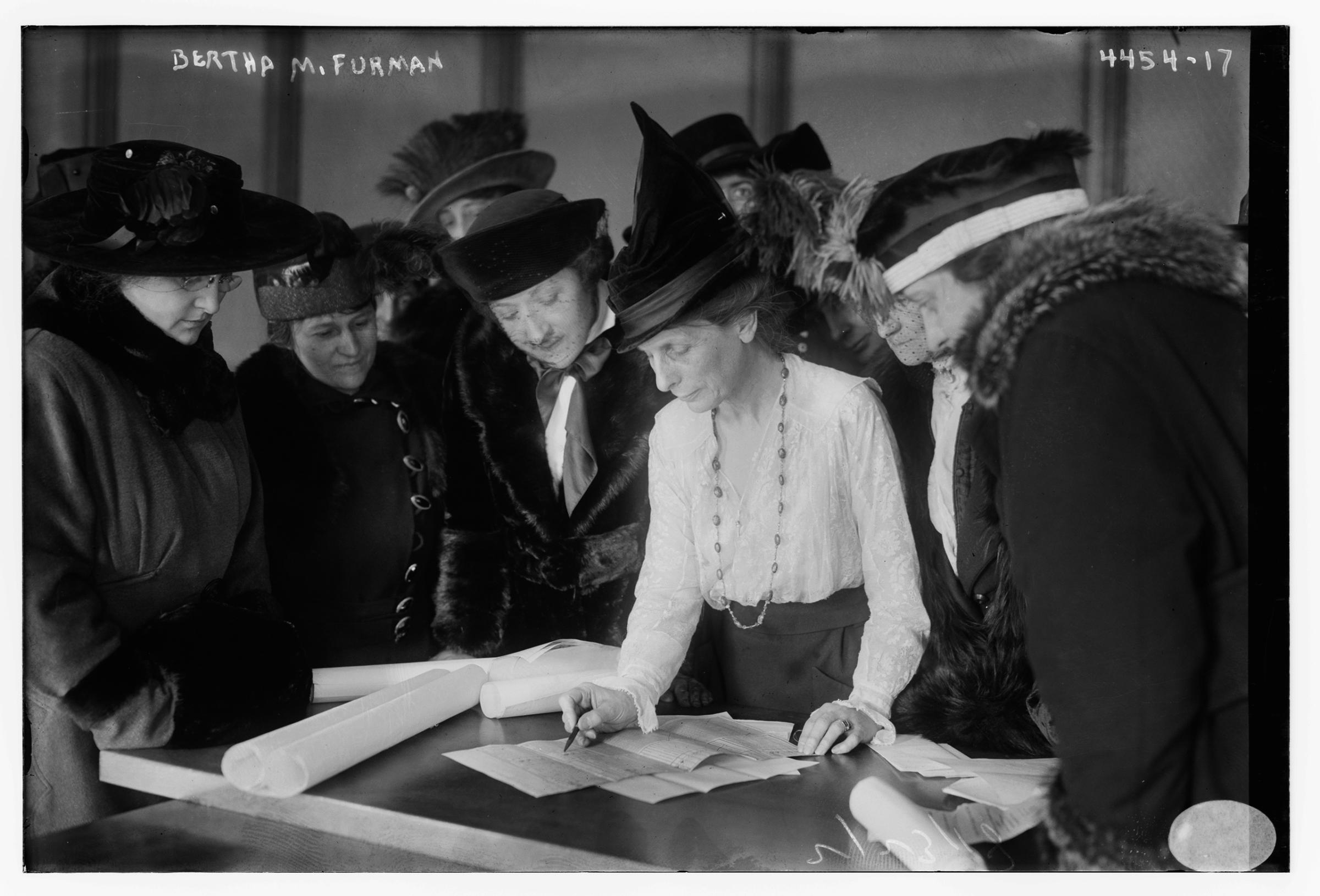 Photograph shows suffragist shows Bertha M. Furman (d. 1930) who worked for the League of Women Voters, teaching women how to vote. (Source: Flickr Commons project, 2016 and similar Bain negative: LC-B2- 4454-16) http://www.loc.gov/pictures/item/ggb2006001399/