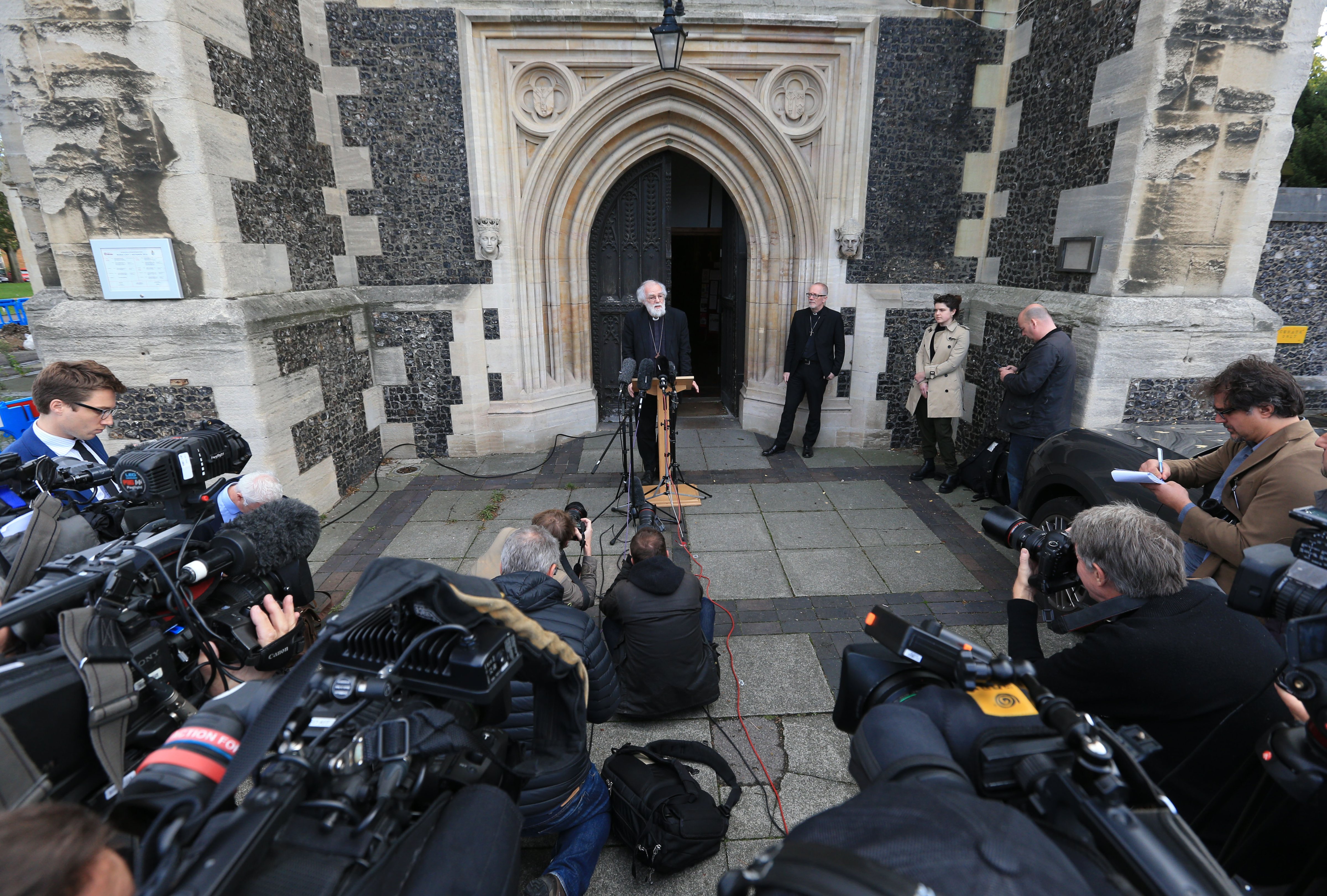 Former Archbishop of Canterbury Dr Rowan Williams speaks to reporters outside Croydon Minster, Croydon, as efforts to resettle migrant children from the Calais "Jungle" are stepped up. Picture date: Monday October 17, 2016. (Jonathan Brady—PA Wire/Press Association Images)