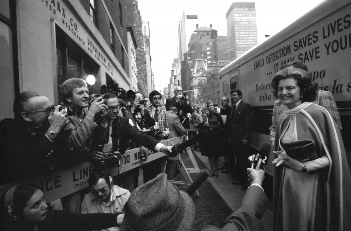 First lady Betty Ford, right, answers questions from the press prior to her tour of the Guttman Institute for Early Detection of Breast Cancer in New York City on Nov. 7, 1975. (MCT / Getty Images)