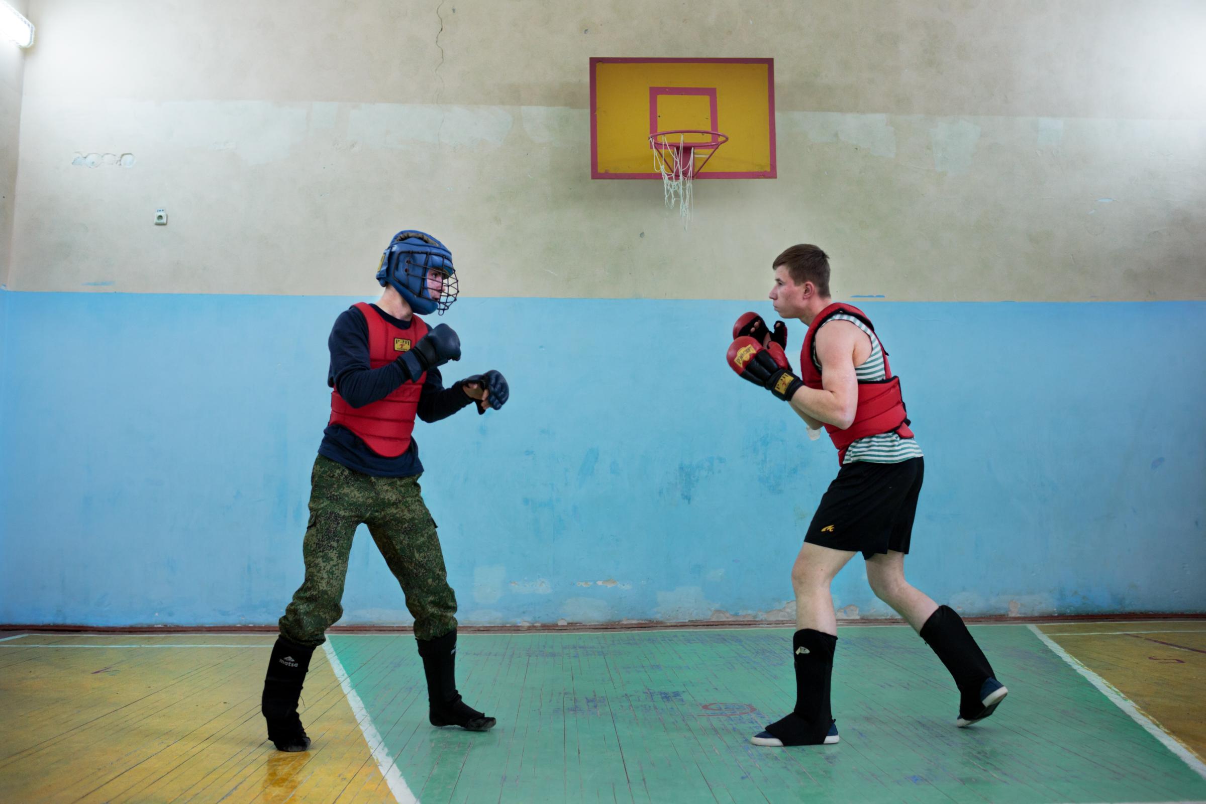 Students practice boxing and martial arts after school at the Diveevo Public School gymnasium on Apr. 6, 2016 in Diveevo, Russia.