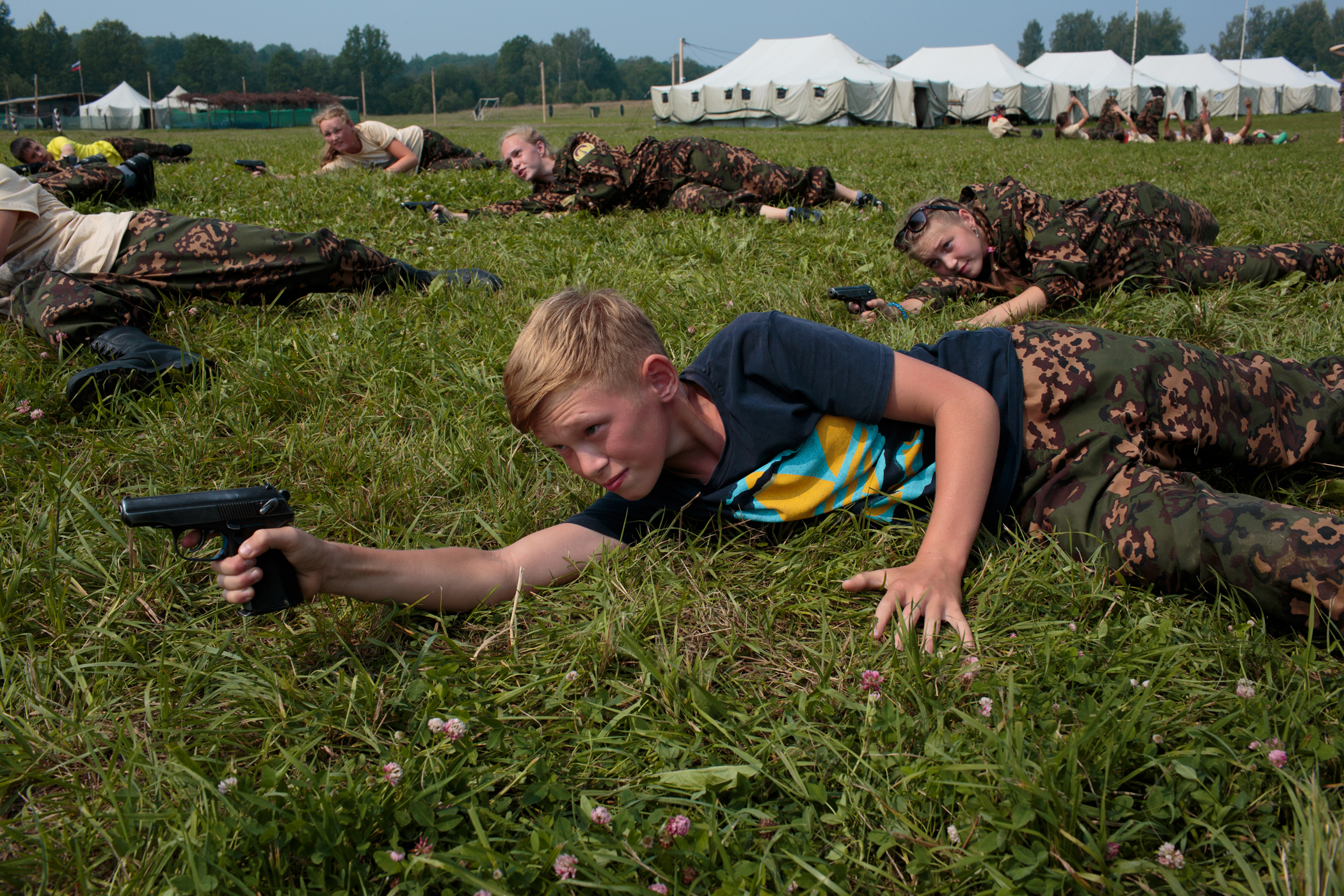 Students practice shooting air soft guns at a Historical-War Camp in Borodino, Russia. Borodino is where the deadliest day of the Napoleonic War was fought in 1812. 350 kids attend the camp, ranging in age from 11 to 17. It teaches campers about weapons, bases, and warfare. The project statement of the camp says: "To awaken in the younger generation a keen interest in the history of the Fatherland, the glorious deeds of our ancestors, to facilitate the expansion of military-historical knowledge."