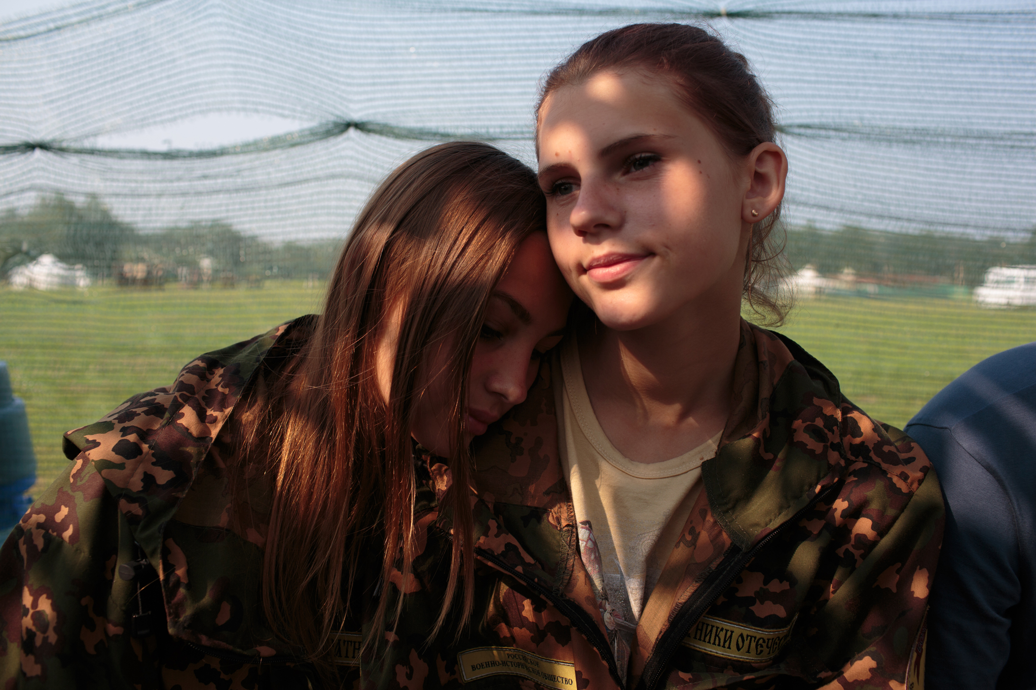 (left) Nastya Gobritskaya, from Moscow and Alina Klikova from Medin rest between tactical drills at the Historical-War Camp, in Borodino, Russia.
