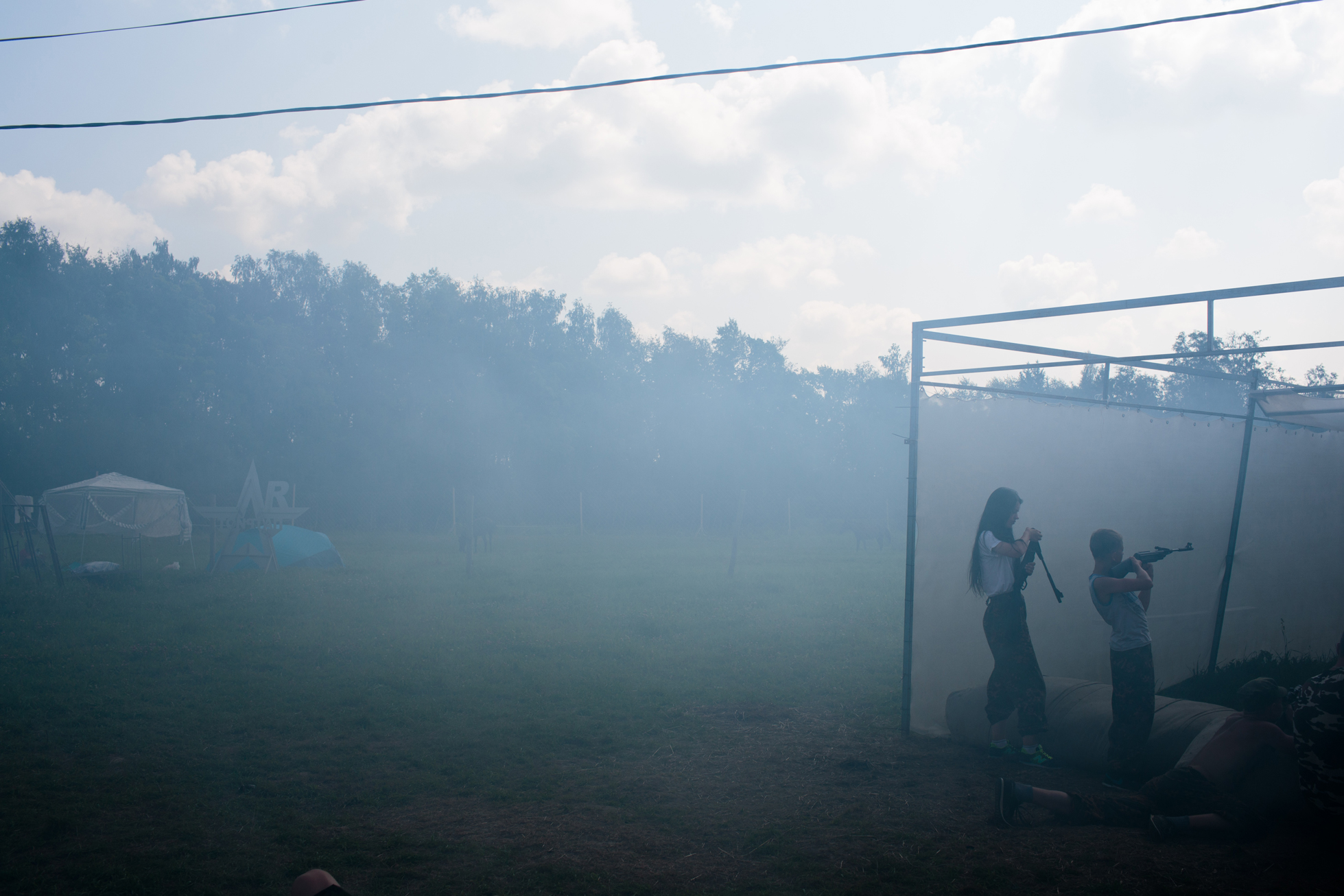 Campers at target practice. The smoke is from launching fake grenades.