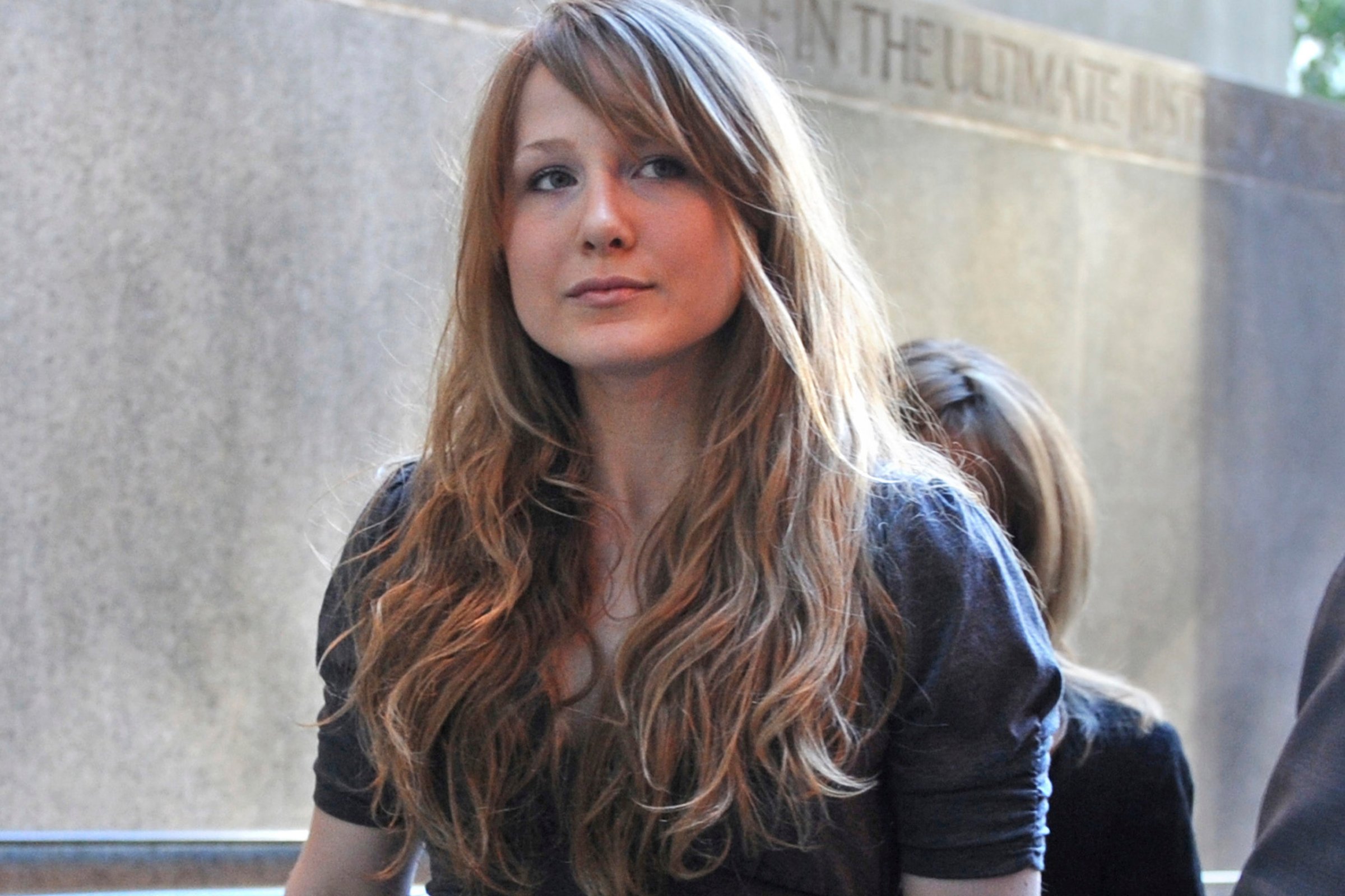 Caroline Giuliani arrives at Manhattan criminal court with her mother, Donna Hanover, in background on Aug. 31, 2010.