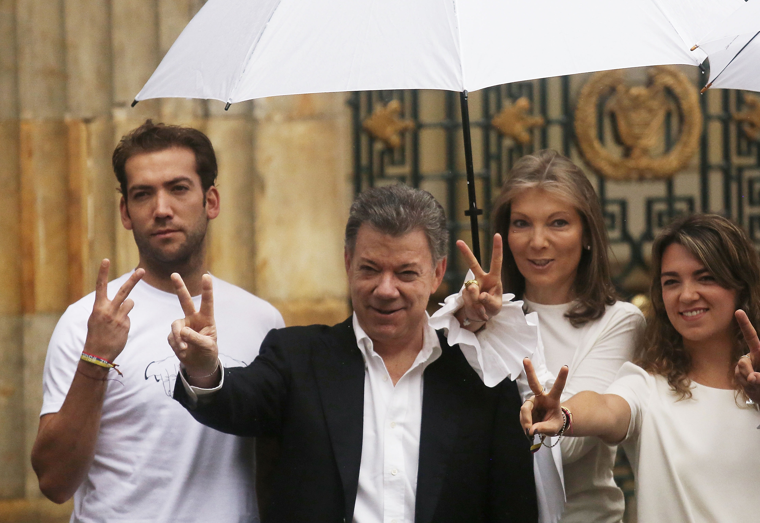 Santos with his wife and children after voting to end hostilities with FARC on Oct. 2 (Mario Tama—Getty Images)