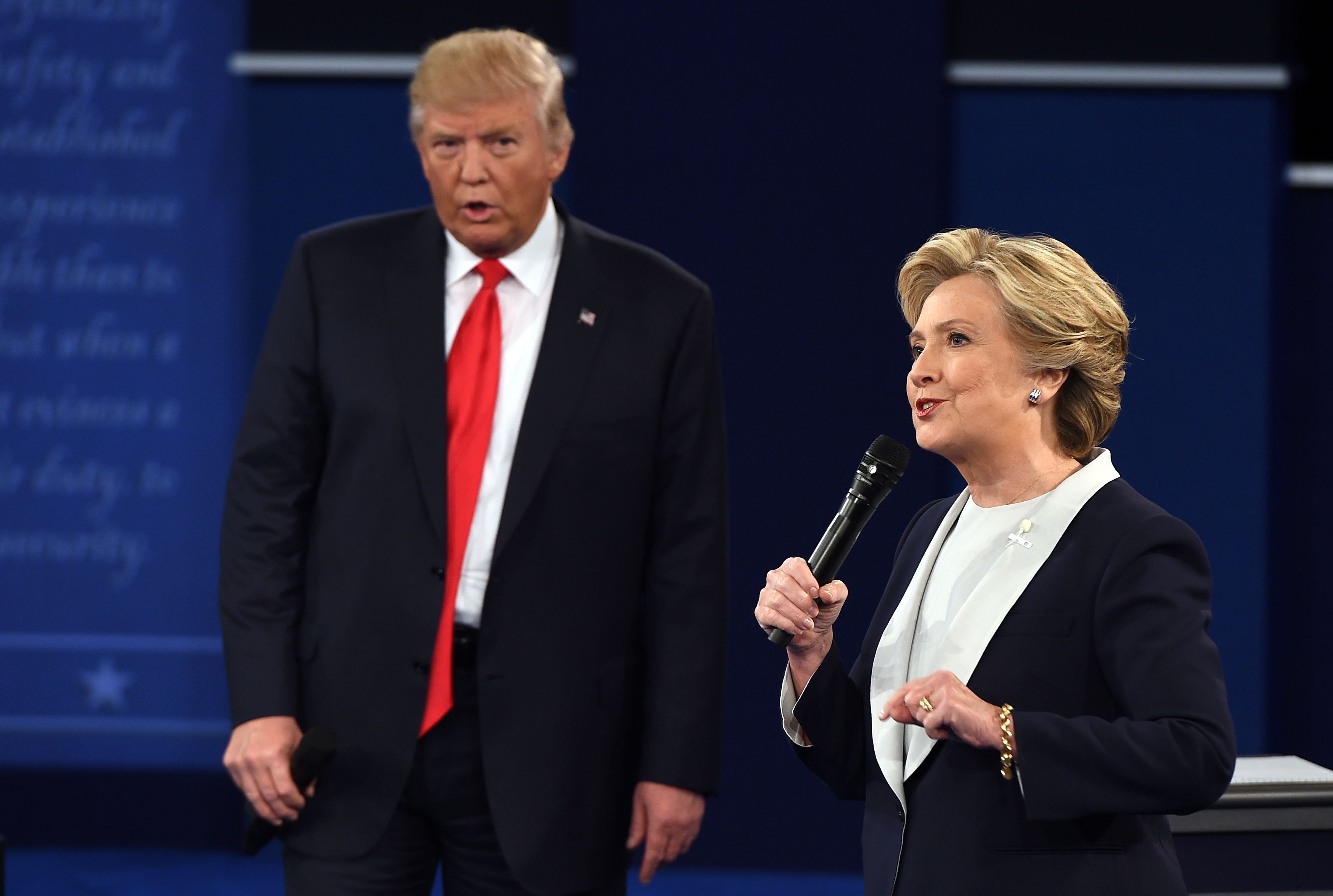 Democratic presidential candidate Hillary Clinton and Republican presidential candidate Donald Trump debate during the second presidential debate at Washington University in St. Louis on Oct. 9, 2016.