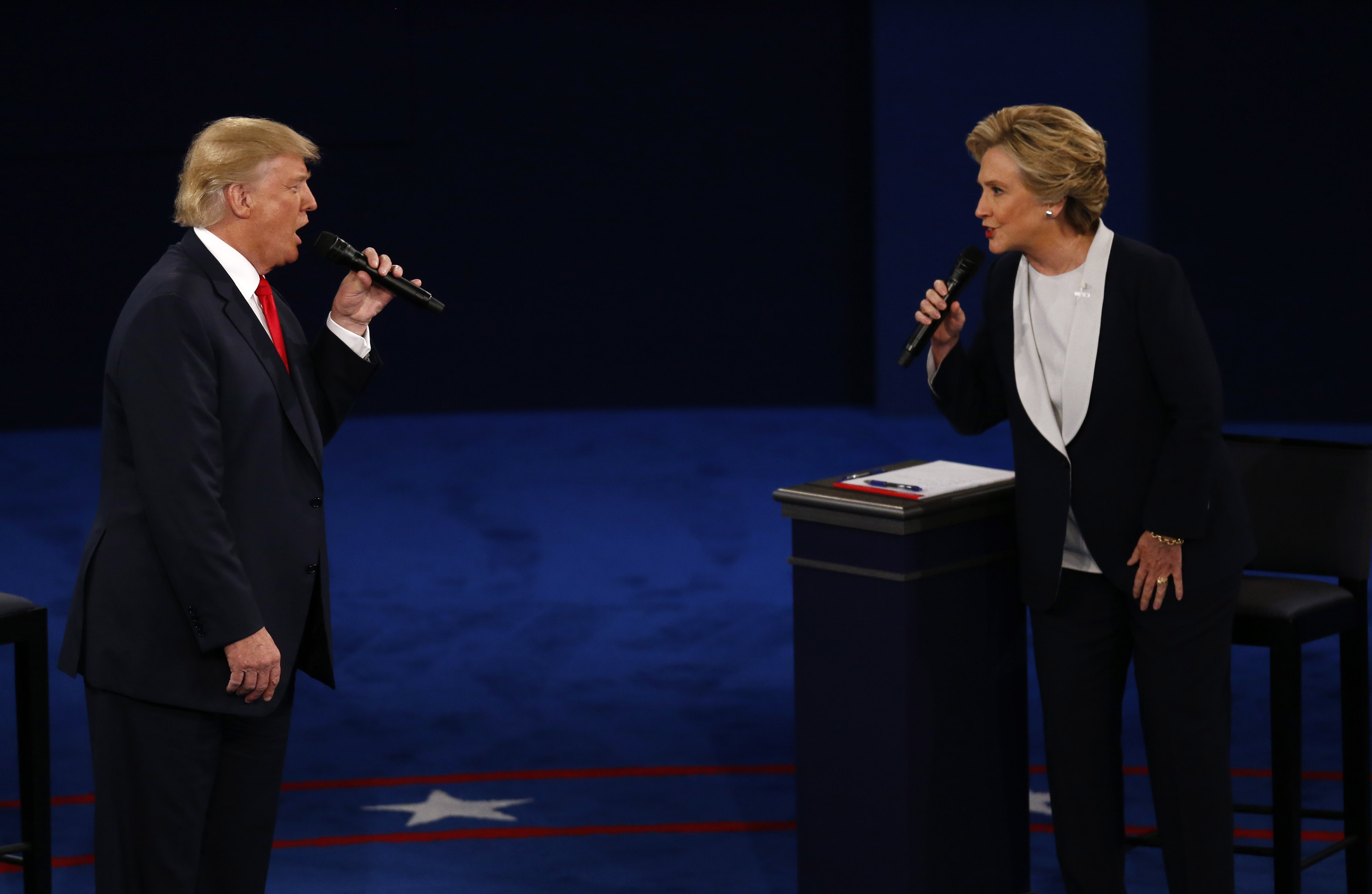Donald Trump, 2016 Republican presidential nominee, and Hillary Clinton, 2016 Democratic presidential nominee, speak during the second U.S. presidential debate at Washington University in St. Louis, on Oct. 9, 2016. (Bloomberg via Getty Images)