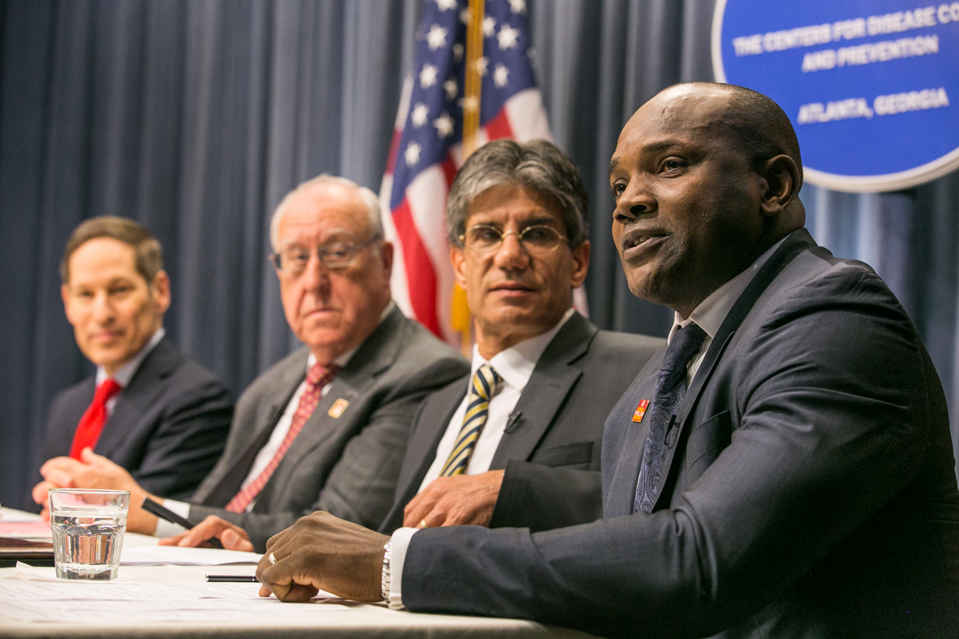 Dennis Ogbe, right, during a World Polio Day panel at the CDC
