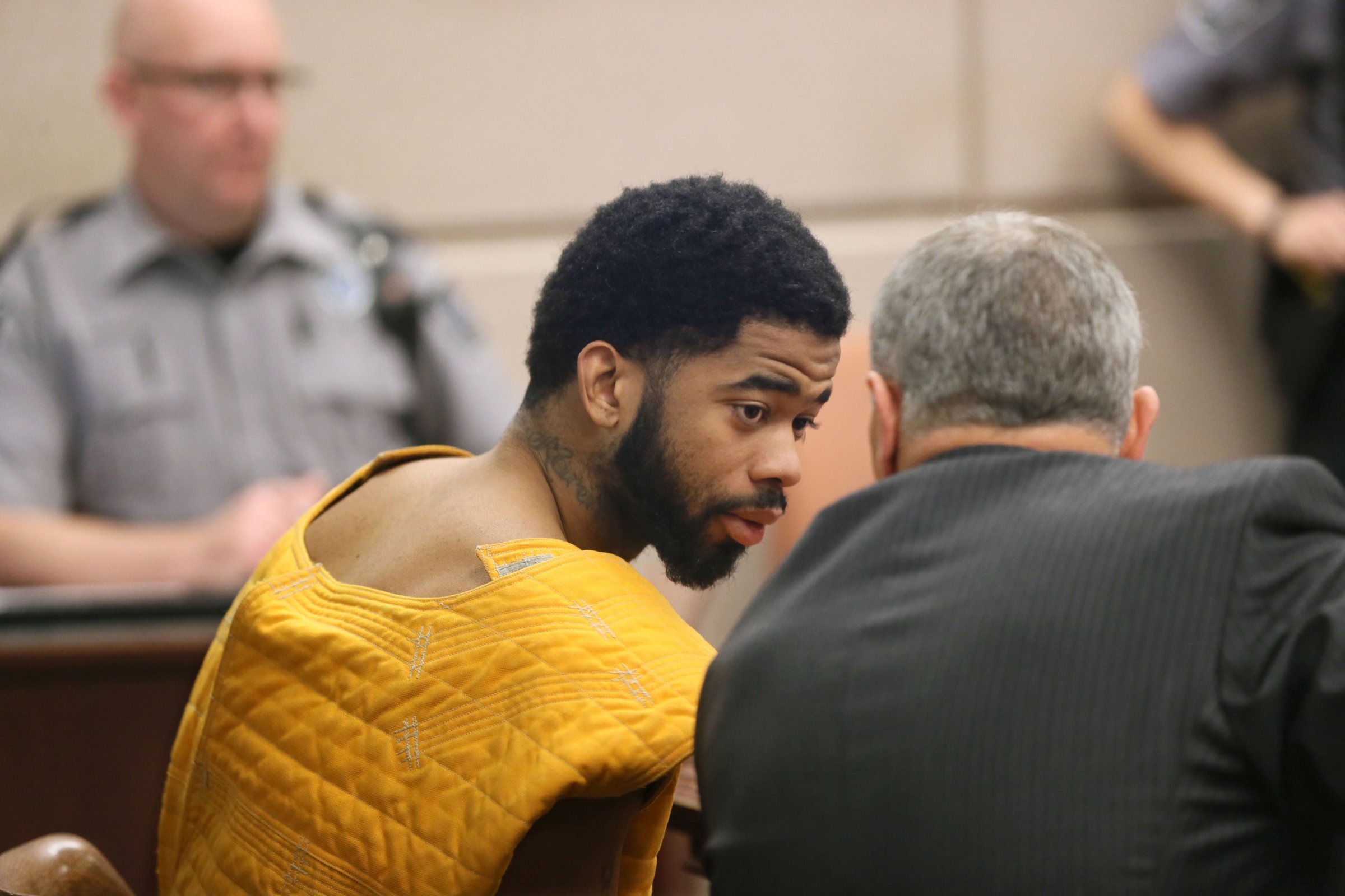 Dominique Heaggan-Brown appears in Milwaukee County Circuit Court, Wednesday, Oct. 26, 2016 in Milwaukee. Heaggan-Brown a Milwaukee police officer whose fatal shooting of a black man sparked a weekend of violent unrest in the city has been ordered to stand trial on unrelated sex assault charges. He is facing five charges that accuse him of sexually assaulting two men and soliciting sex from two others. He's jailed on $100,000 bond. (Michael Sears/Milwaukee Journal Sentinel via AP)