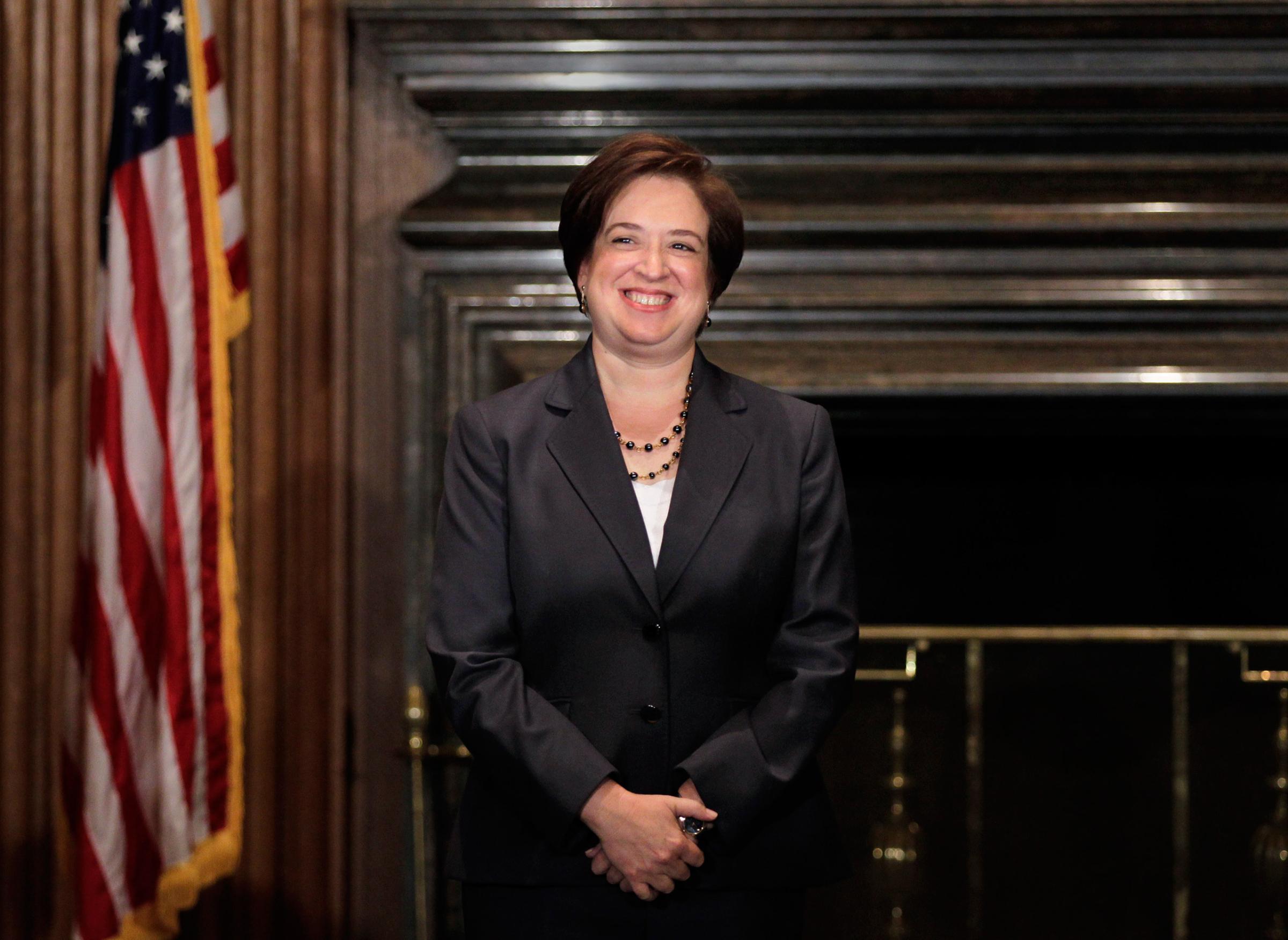 Elena Kagan smiles after being sworn in as the Supreme Court's newest member by Chief Justice John Roberts at the Supreme Court Building August 7, 2010 in Washington, DC.