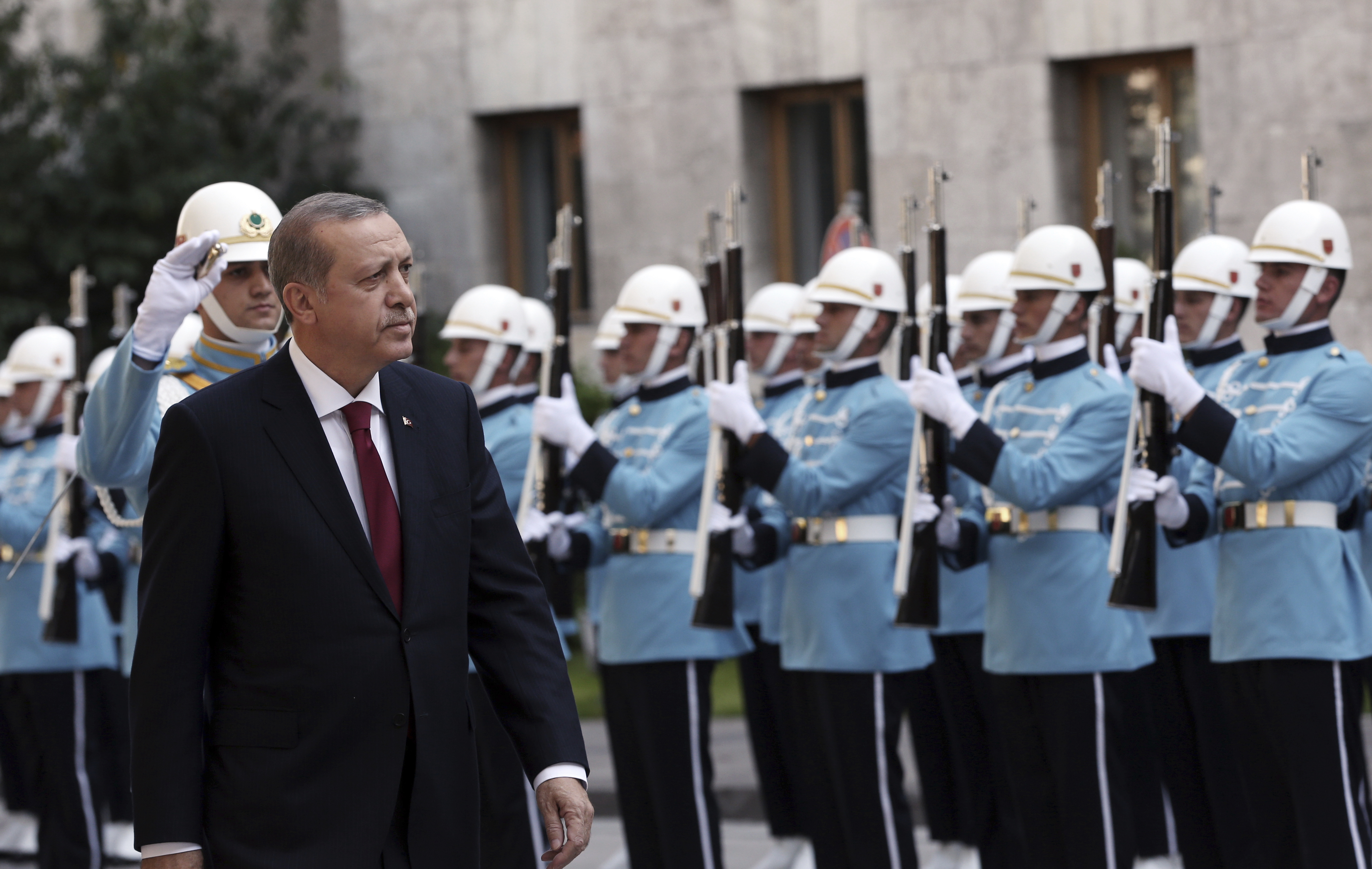 Turkey's President Recep Tayyip Erdogan inspects a military honour guard as he arrives to address the parliament in Ankara, Turkey, Saturday, Oct. 1, 2016. (Burhan Ozbilici—AP)
