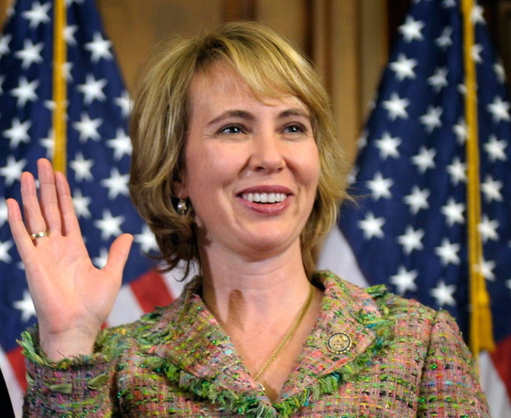 Rep. Gabrielle Giffords, D-Ariz., takes part in a reenactment of her swearing-in, on Capitol Hill in Washington, Jan. 5, 2011.