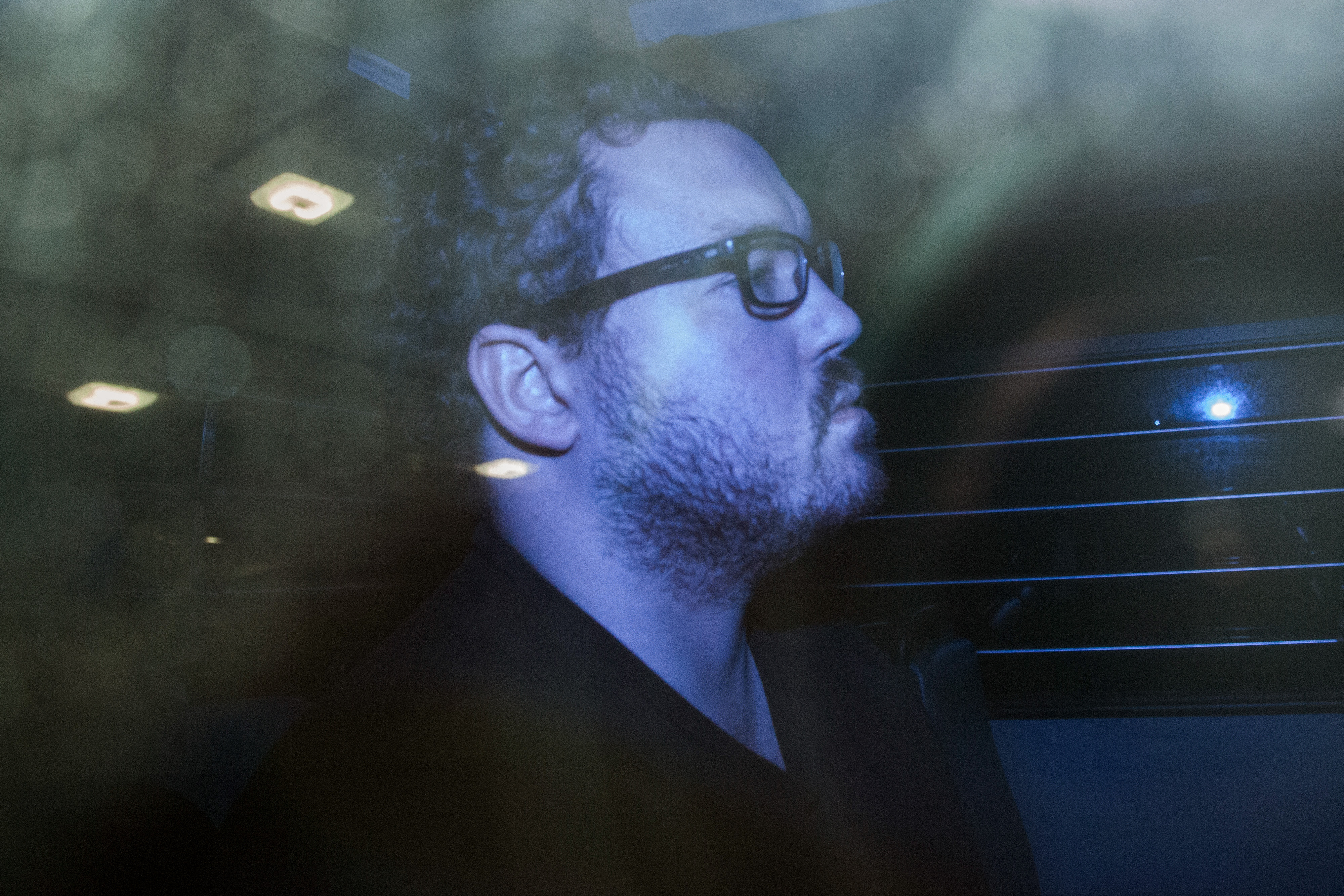 Rurik George Caton Jutting leaves the Eastern Magistrates' Court in a prison van in Hong Kong on Nov. 3, 2014 (Bloomberg/Getty Images)