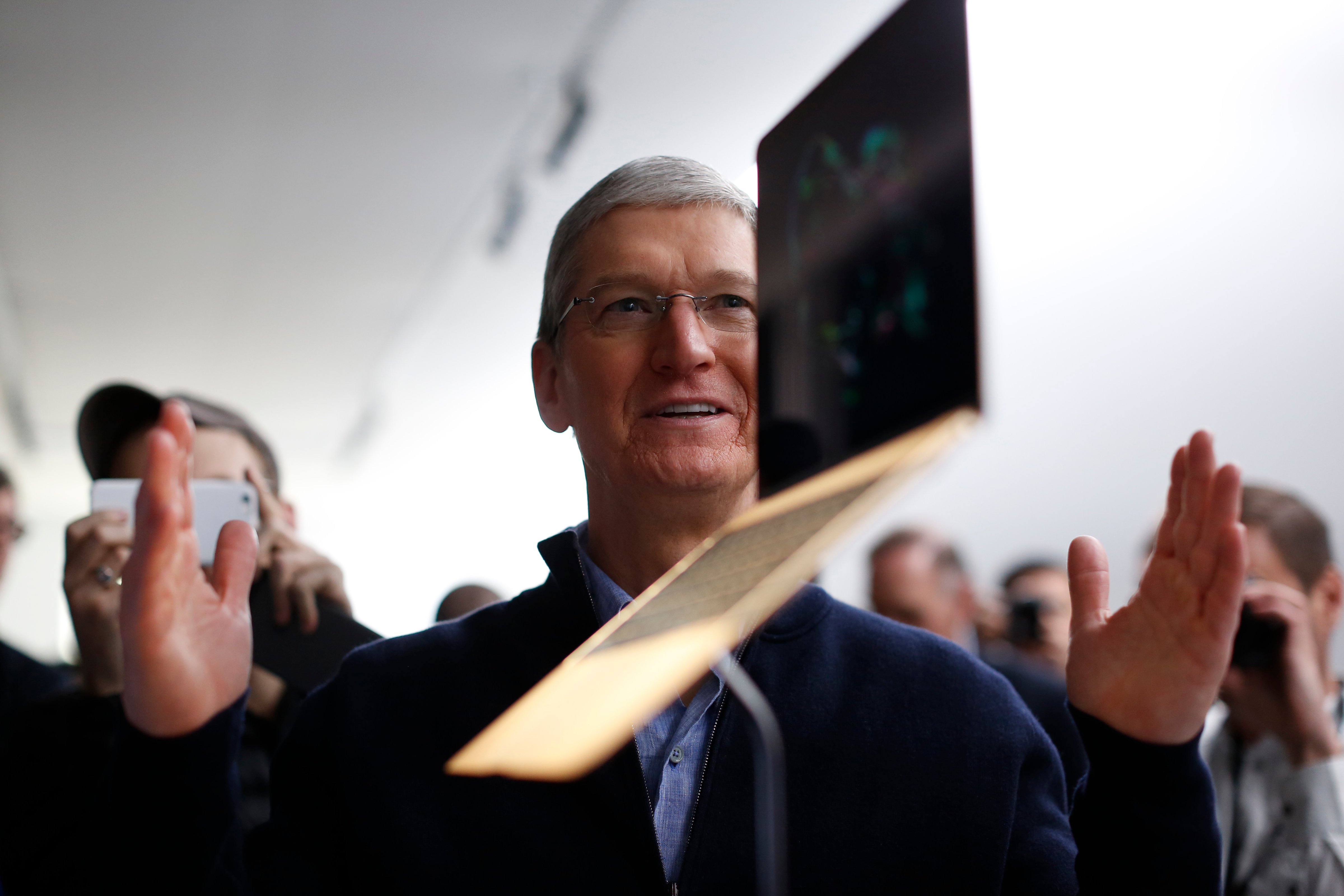 Apple CEO Tim Cook stands in front of an MacBook on display after an Apple special event at the Yerba Buena Center for the Arts on March 9, 2015 in San Francisco, California. (Stephen Lam&mdash;Getty Images)