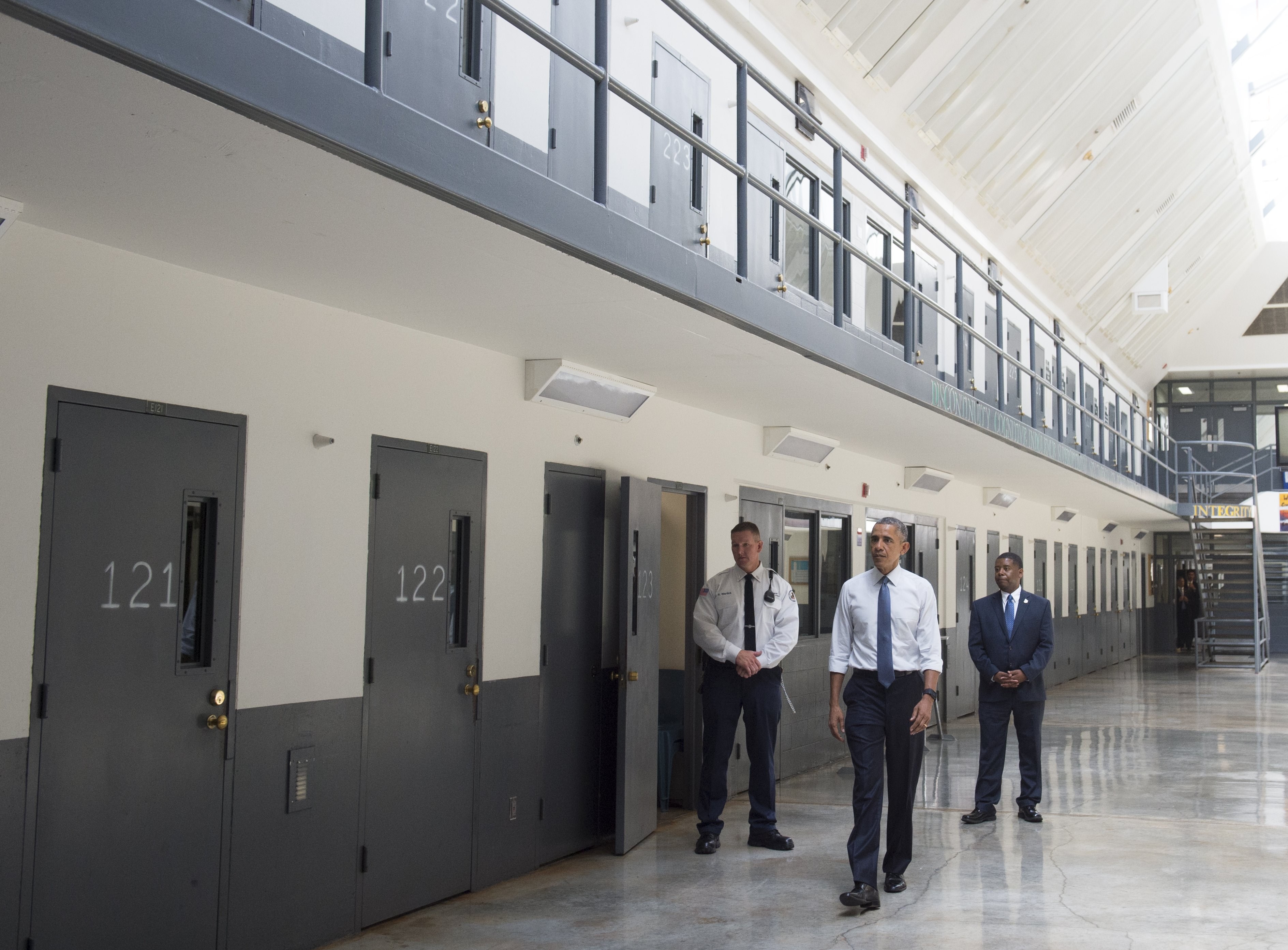 Barack Obama, alongside Charles Samuels (R), Bureau of Prisons Director, and Ronald Warlick (L), a correctional officer, tours a cell block at the El Reno Federal Correctional Institution in El Reno, Oklahoma, July 16, 2015. (Saul Loeb—AFP/Getty Images)