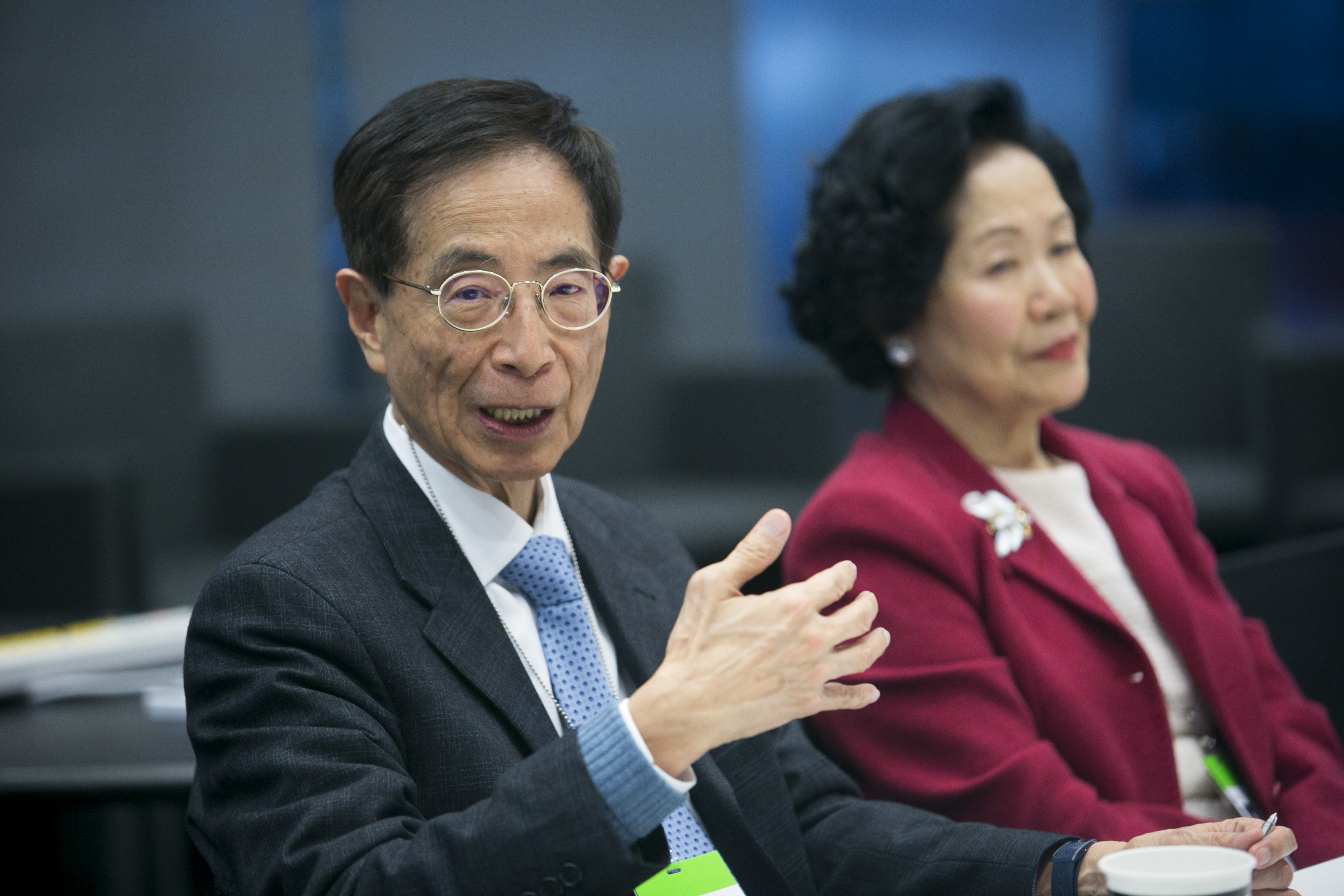 Martin Lee, former member of Hong Kong's Legislative Council, left, speaks as Anson Chan, Hong Kong's former top civil servant, listens during an interview in New York City on March 31, 2014 (Bloomberg/Getty Images)