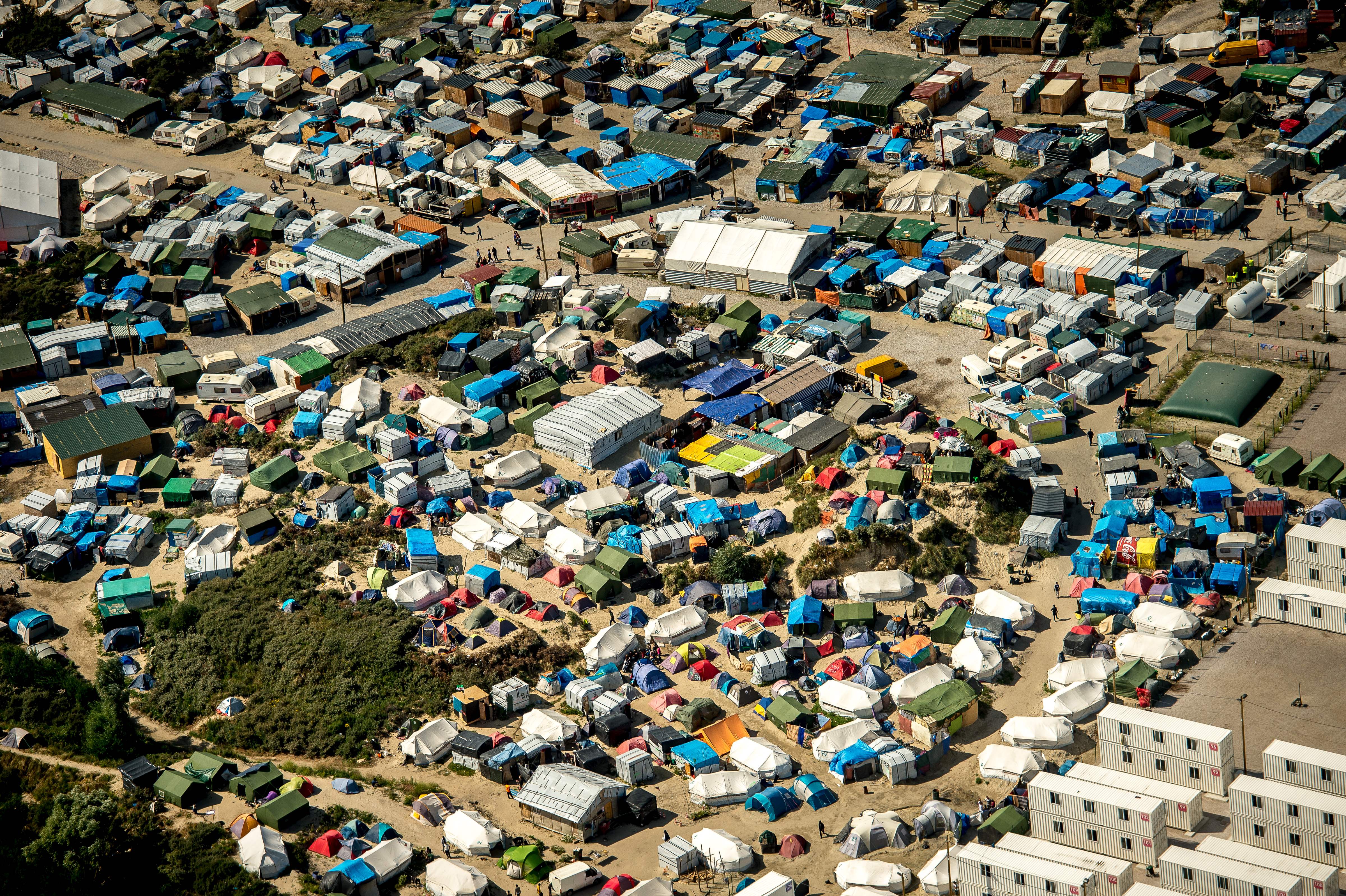 This aerial view taken on Aug. 16, 2016, in Calais, northern France shows tents of the "jungle" camp where over 9000 migrants live according to different NGOs. (PHILIPPE HUGUEN—AFP/Getty Images)