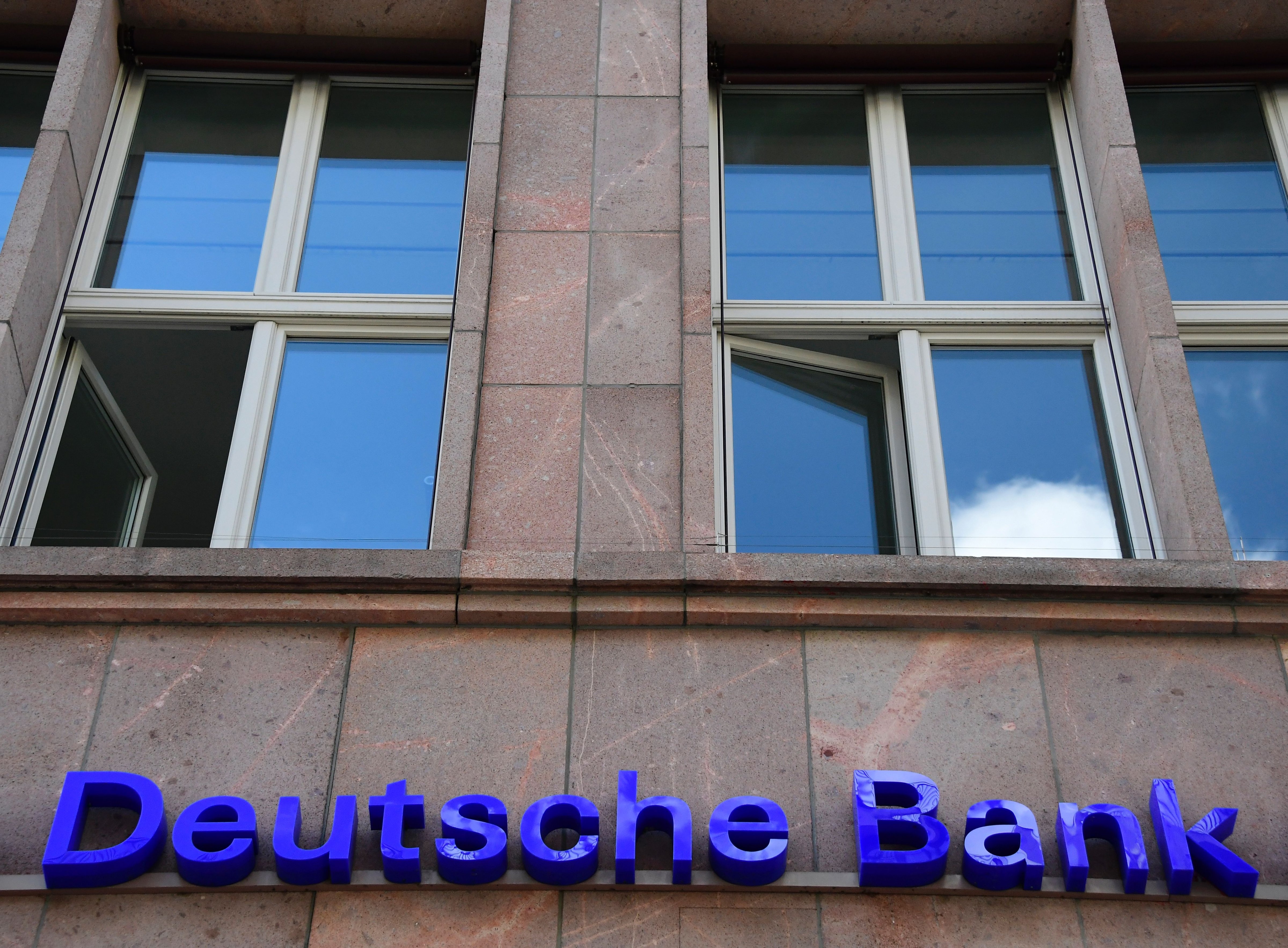 The logo of Germany's biggest lender Deutsche Bank is seen on a branch of the bank in Berlin's Mitte district on September 30, 2016.
                      Shares in Deutsche Bank plummeted on the Frankfurt stock market, dragging other European banks and global markets down with it, after reports some customers were pulling money out. (TOBIAS SCHWARZ—AFP/Getty Images)