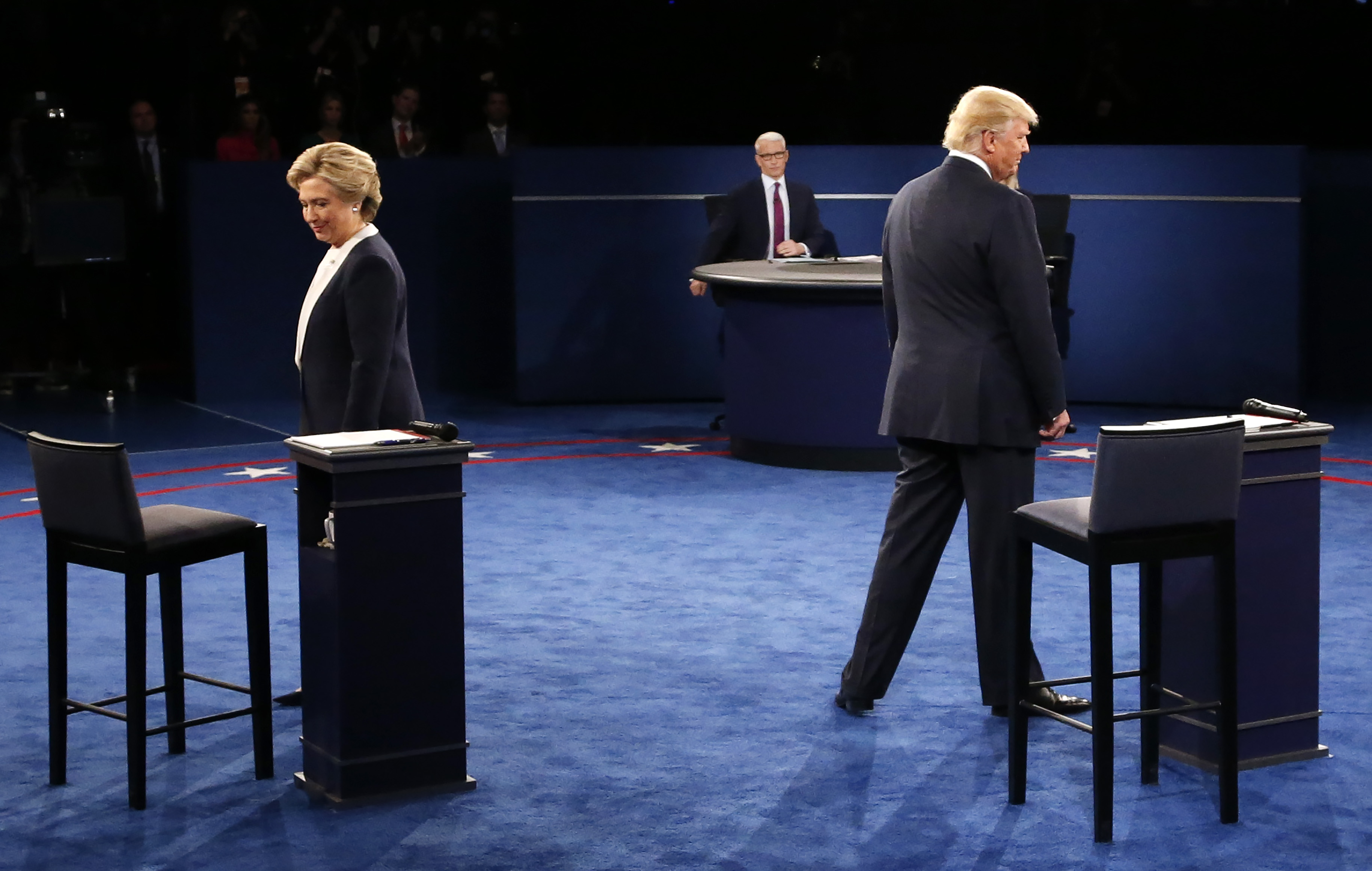 Democratic nominee Hillary Clinton (L) and Republican nominee Donald Trump arrive on stage during the second presidential debate at Washington University in St. Louis, Missouri on October 9, 2016. (Jim Bourg&mdash;AFP/Getty Images)