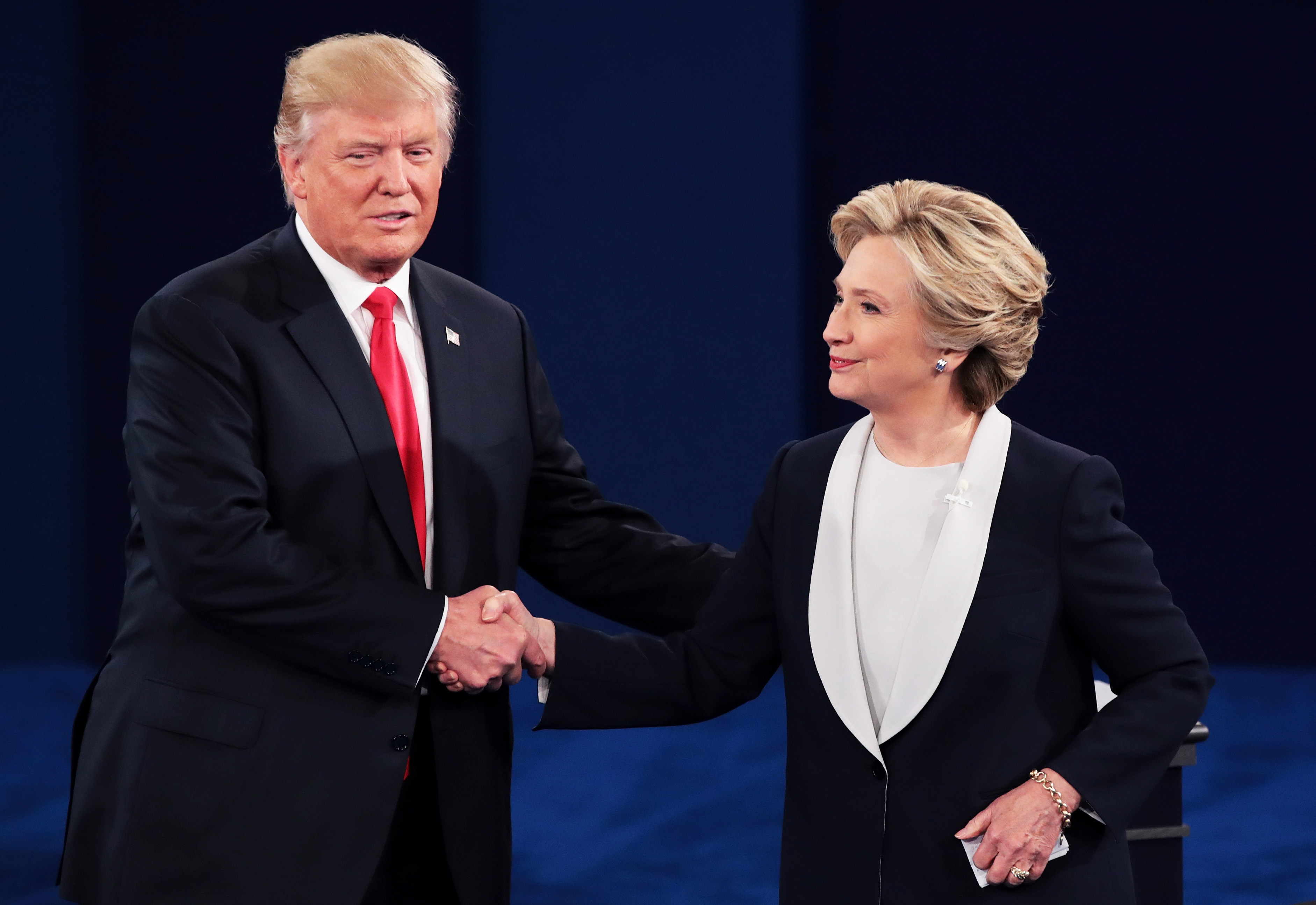 Republican presidential nominee Donald Trump (L) shakes hands with Democratic presidential nominee former Secretary of State Hillary Clinton during the town hall debate at Washington University on October 9, 2016 in St Louis, Missouri. This is the second of three presidential debates scheduled prior to the November 8th election. (Scott Olson&mdash;Getty Images)