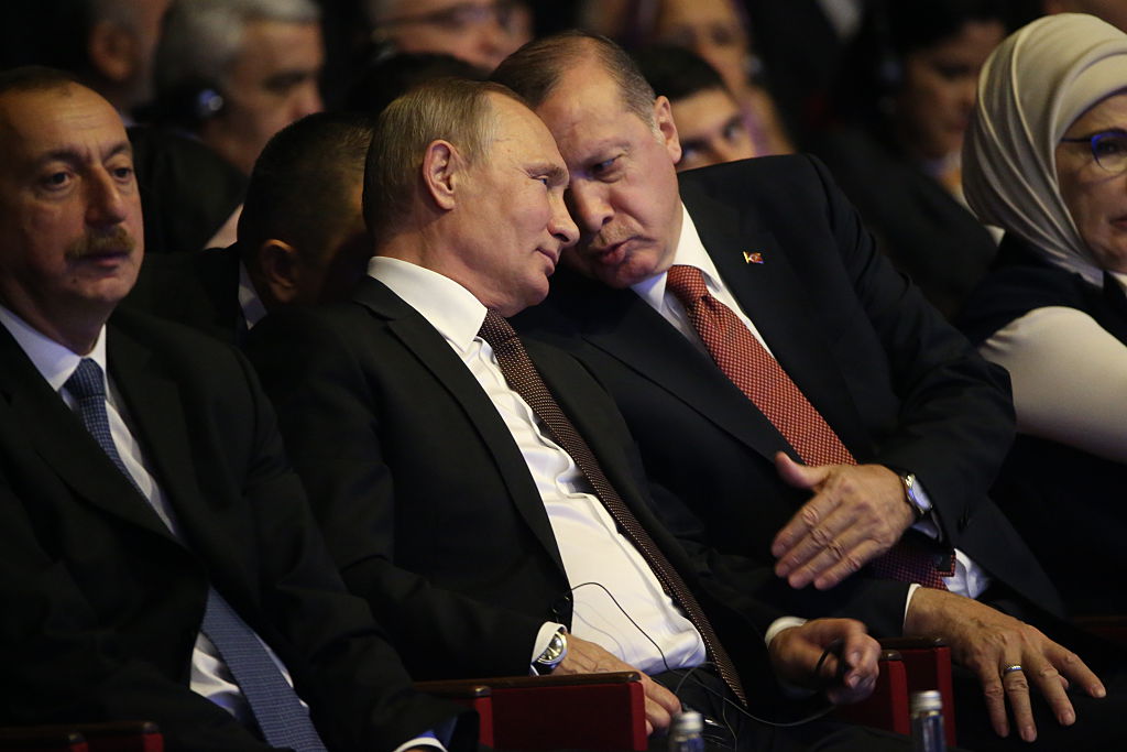 ISTANBUL, TURKEY- OCTOBER 10: (RUSSIA OUT) Russian President Vladimir Putin (L) listens to Turkish President Recep Tayyip Erdogan (R) during the 23rg World Energy Congress, in Istanbul,Turkey, on October, 10, 2016. Putin is on a one-day visit to Turkey. (Photo by Mikhail Svetlov/Getty Images)