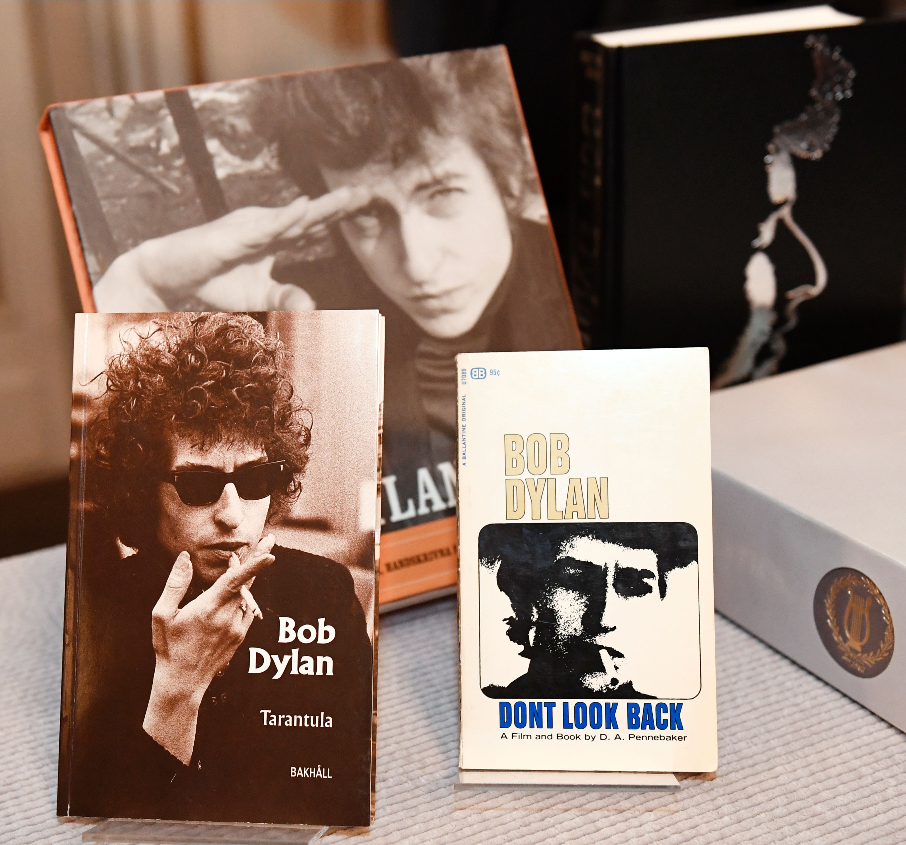 Books by and about US songwriter Bob Dylan who was announced the laureate of the 2016 Nobel Prize in Literature are displayed at the Swedish Academy in Stockholm, Sweden, on Oct. 13, 2016. (JONATHAN NACKSTRAND—AFP/Getty Images)