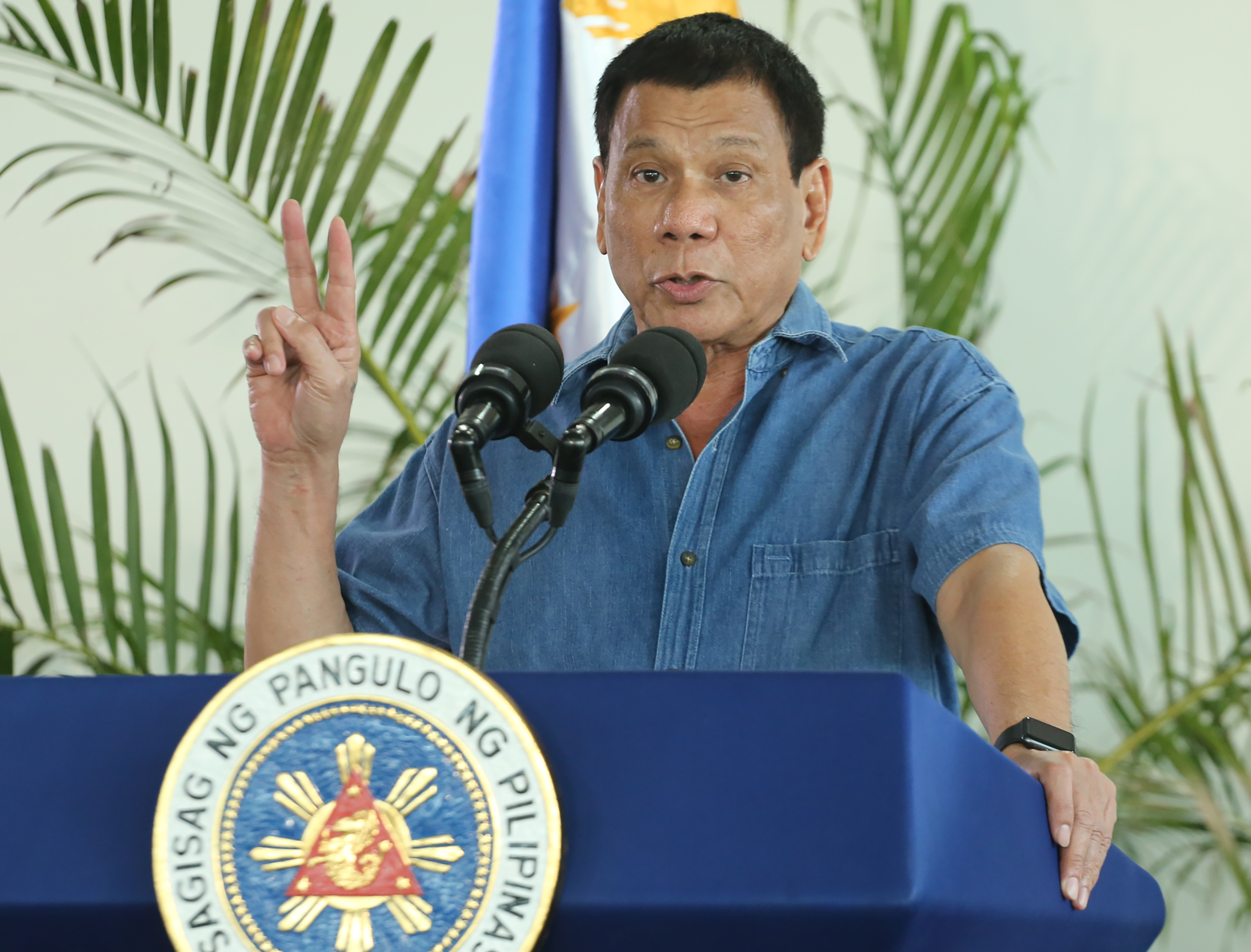 Philippine President Rodrigo Duterte gestures as he delivers his speech prior to departing for a visit to Brunei and China at Davao airport on October 16, 2016. (AFP/Getty Images)
