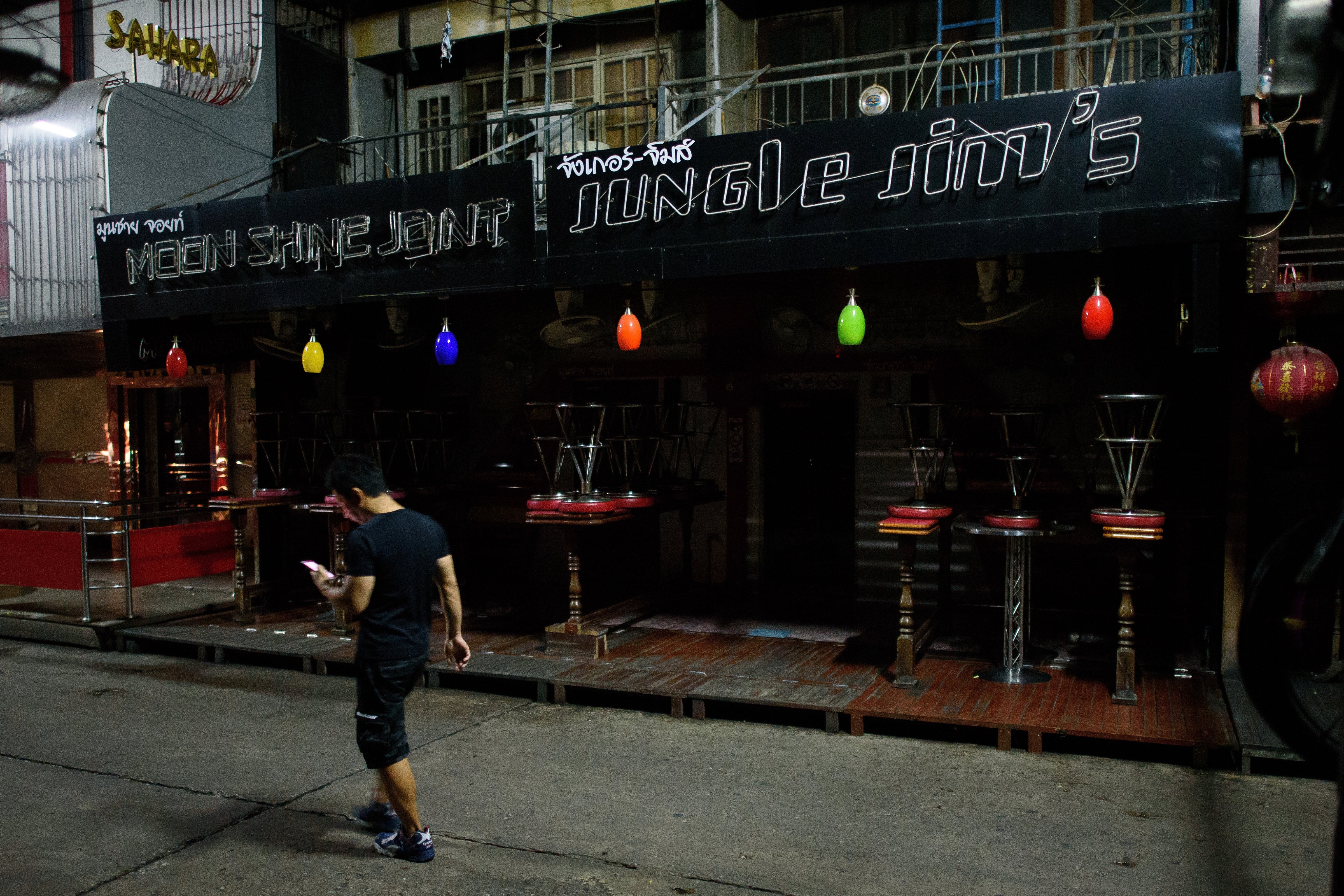 The clubs and bars of the adult entertainment district Soi Cowboy remain shuttered and silent as the country continues to mourn the loss of its King on Oct. 16, 2016, in Bangkok (Leon Neal—Getty Images)