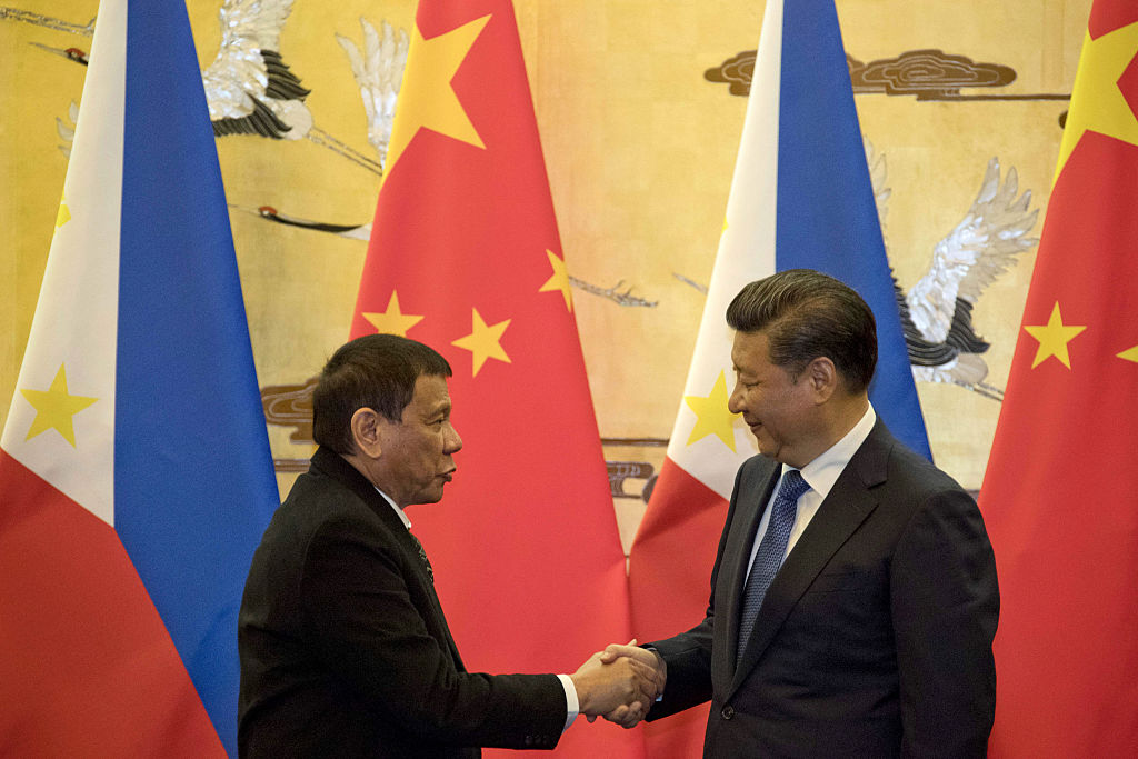 Philippines' President Rodrigo Duterte (L) and his Chinese counterpart Xi Jinping shake hands after a signing ceremony in Beijing on October 20, 2016. 
                      Duterte met with his Chinese counterpart Xi on October 20, state media said, as the Philippines leader seeks closer ties with the Asian giant while blasting his US allies. / AFP / POOL        (Photo credit should read /AFP/Getty Images) (AFP&mdash;AFP/Getty Images)