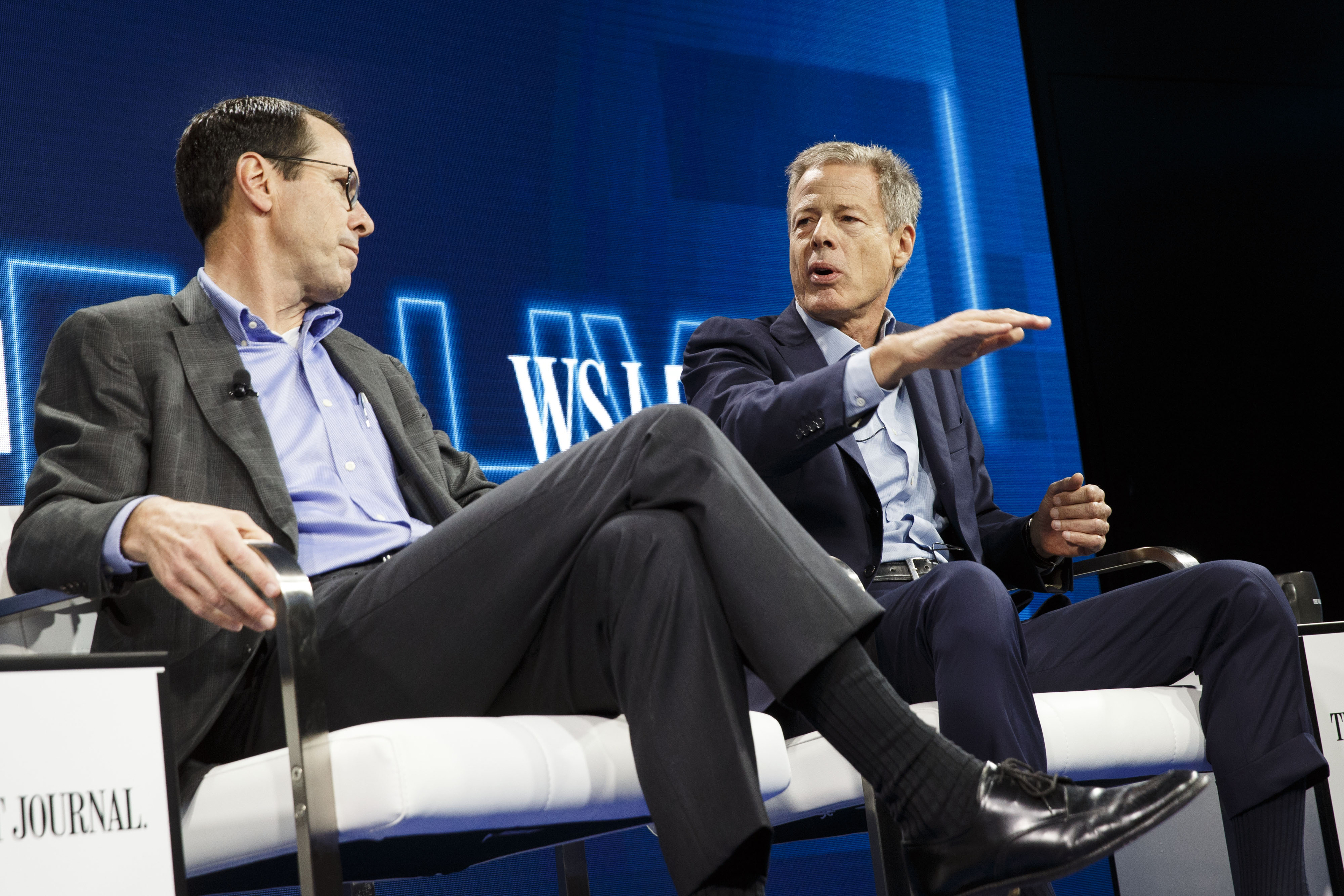 Randall Stephenson, chairman and chief executive officer of AT&amp;T Inc., left, listens while Jeffrey "Jeff" Bewkes, chairman and chief executive officer of Time Warner Inc., speaks during the WSJDLive Global Technology Conference in Laguna Beach, California, U.S., on Tuesday, Oct. 25, 2016. (Bloomberg&mdash;Bloomberg via Getty Images)